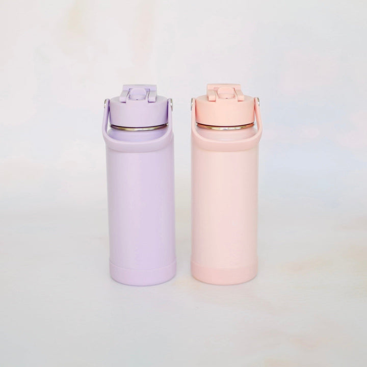 Two pastel-colored water bottles on a light background
