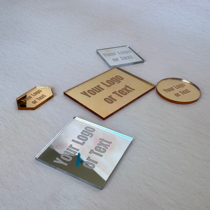 Gold and silver mirror acrylic logo tags at an angle – custom shaped acrylic tags – Etch 'N' Shine