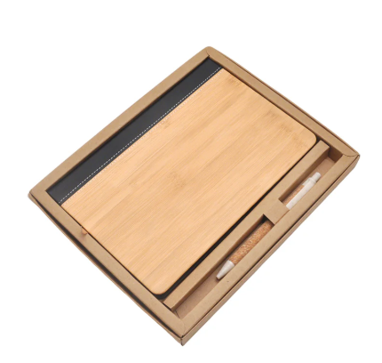 Wooden Bamboo notebook with a pen set in a gift box on a white background