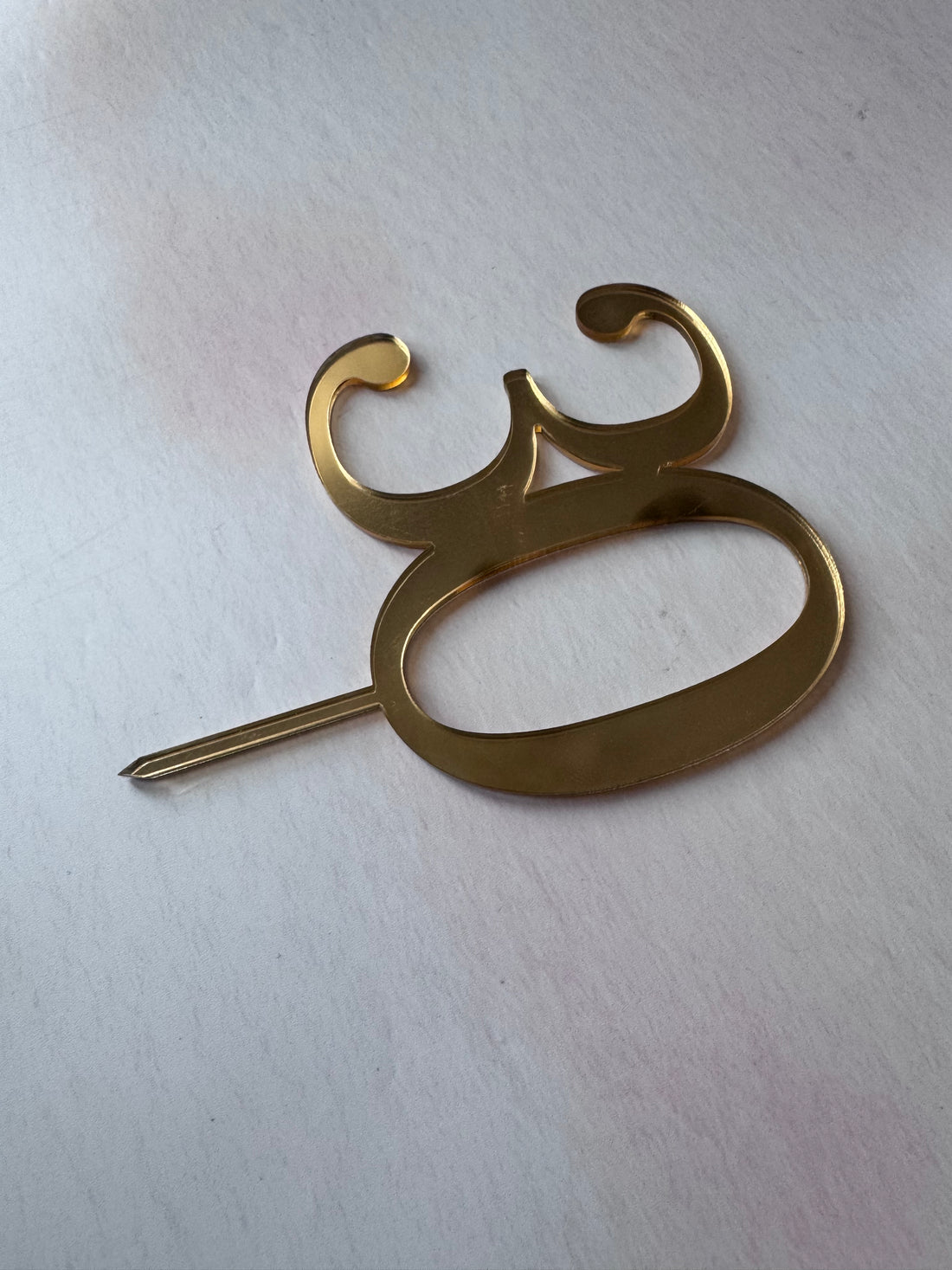 Gold mirror acrylic number 30 topper seen at an angle – personalised mirror acrylic number topper – Etch 'N' Shine