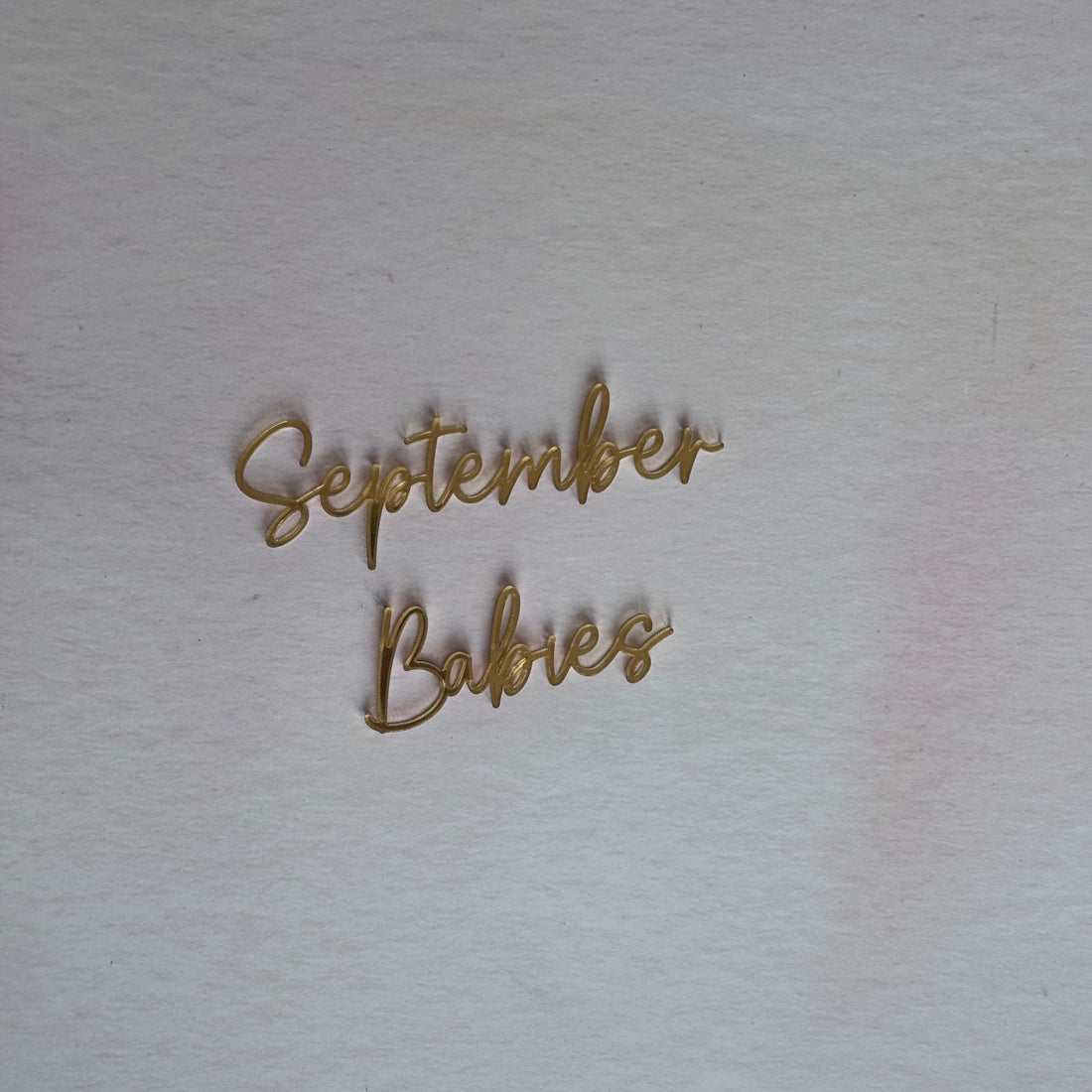 Gold script 'September Babies' acrylic topper, second view – bespoke laser-cut cake topper – Etch 'N' Shine