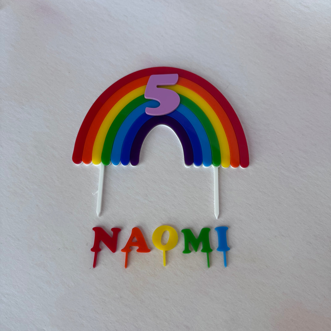 Rainbow arch topper and NAOMI name letters, second flat lay – bespoke rainbow topper set – Etch 'N' Shine