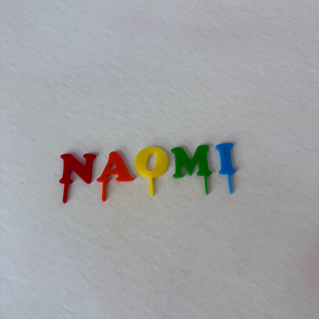 NAOMI acrylic name letters in rainbow colours, second view – personalised name topper – Etch 'N' Shine