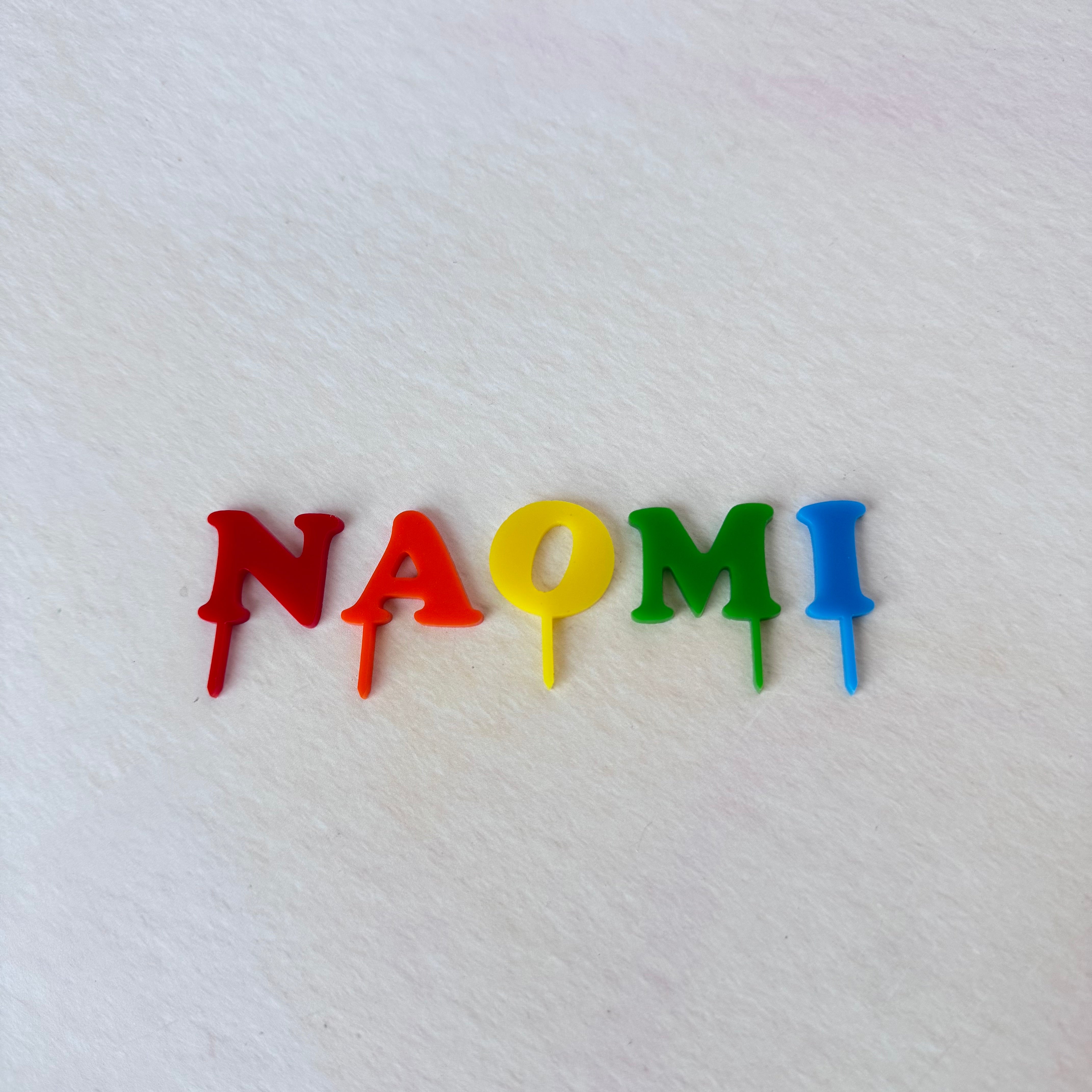 NAOMI acrylic name letters in rainbow colours, third view – personalised name topper – Etch 'N' Shine