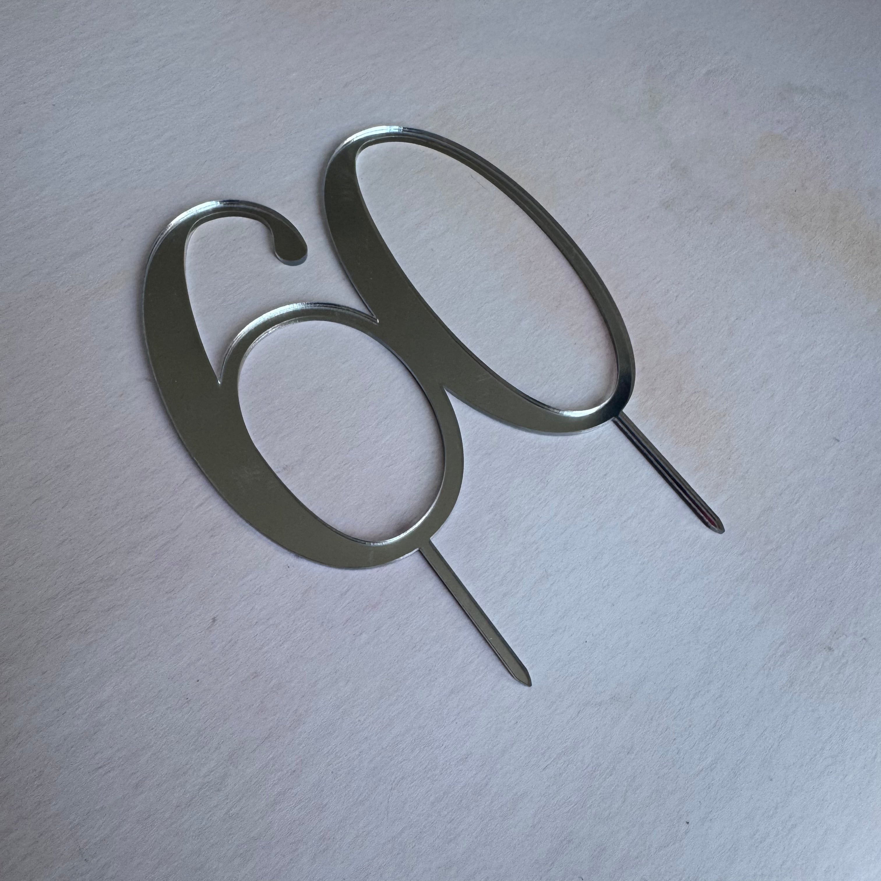 Silver mirror acrylic number 60 topper seen at an angle – personalised mirror acrylic number topper – Etch 'N' Shine