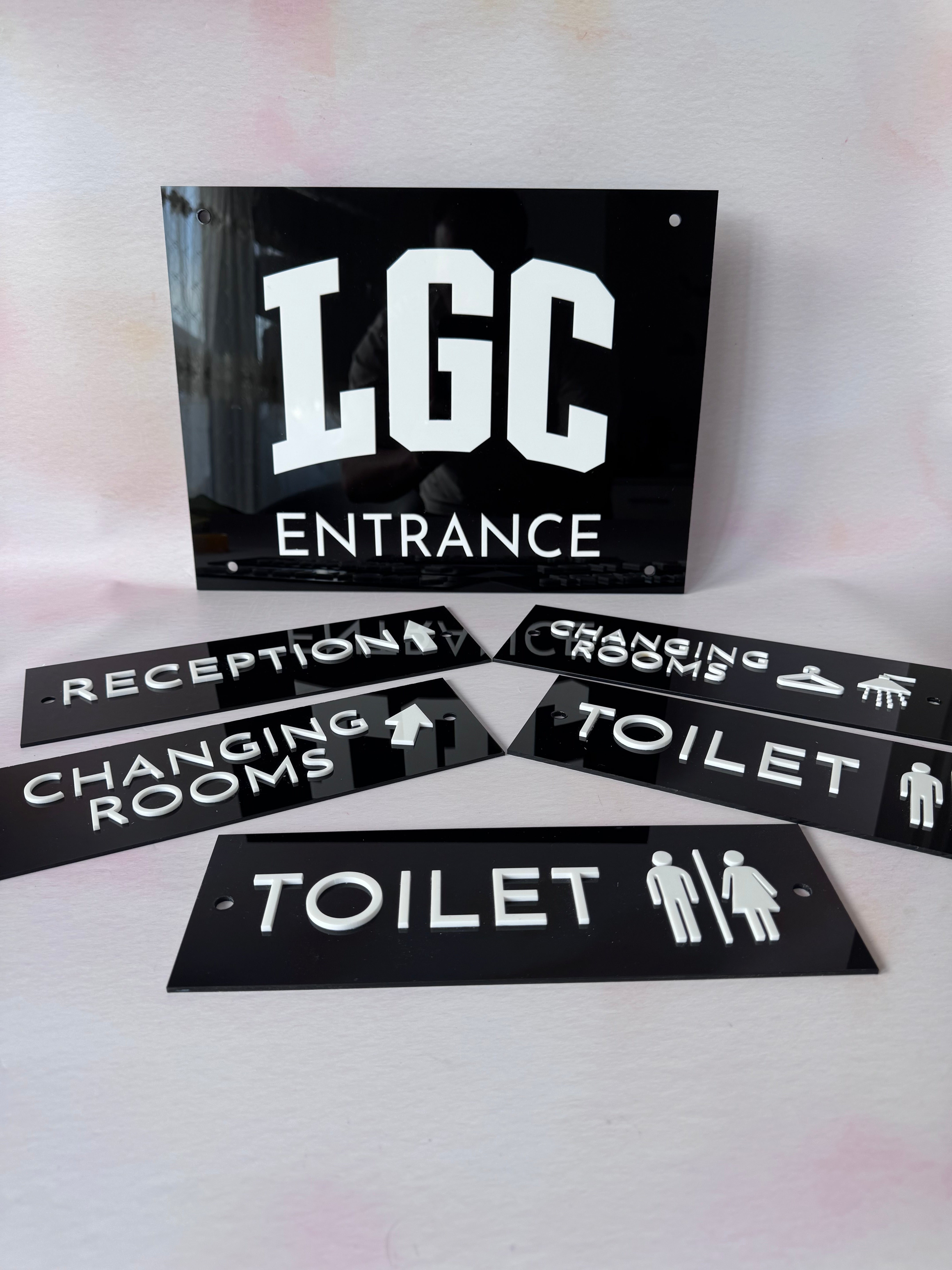 Custom black acrylic business and door signage set for LGC