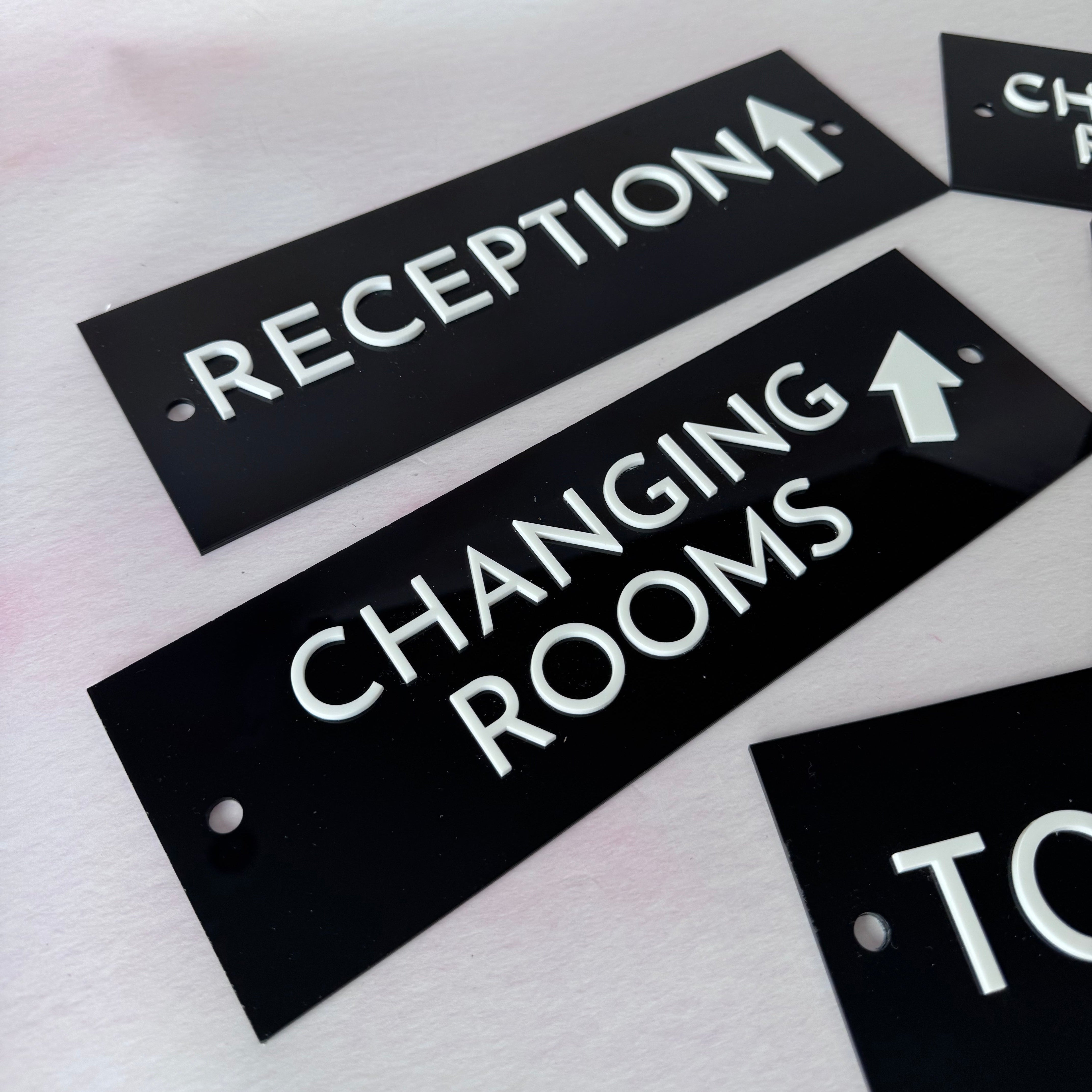 Reception and Changing Rooms signs with directional arrows – black acrylic door signs – Etch 'N' Shine