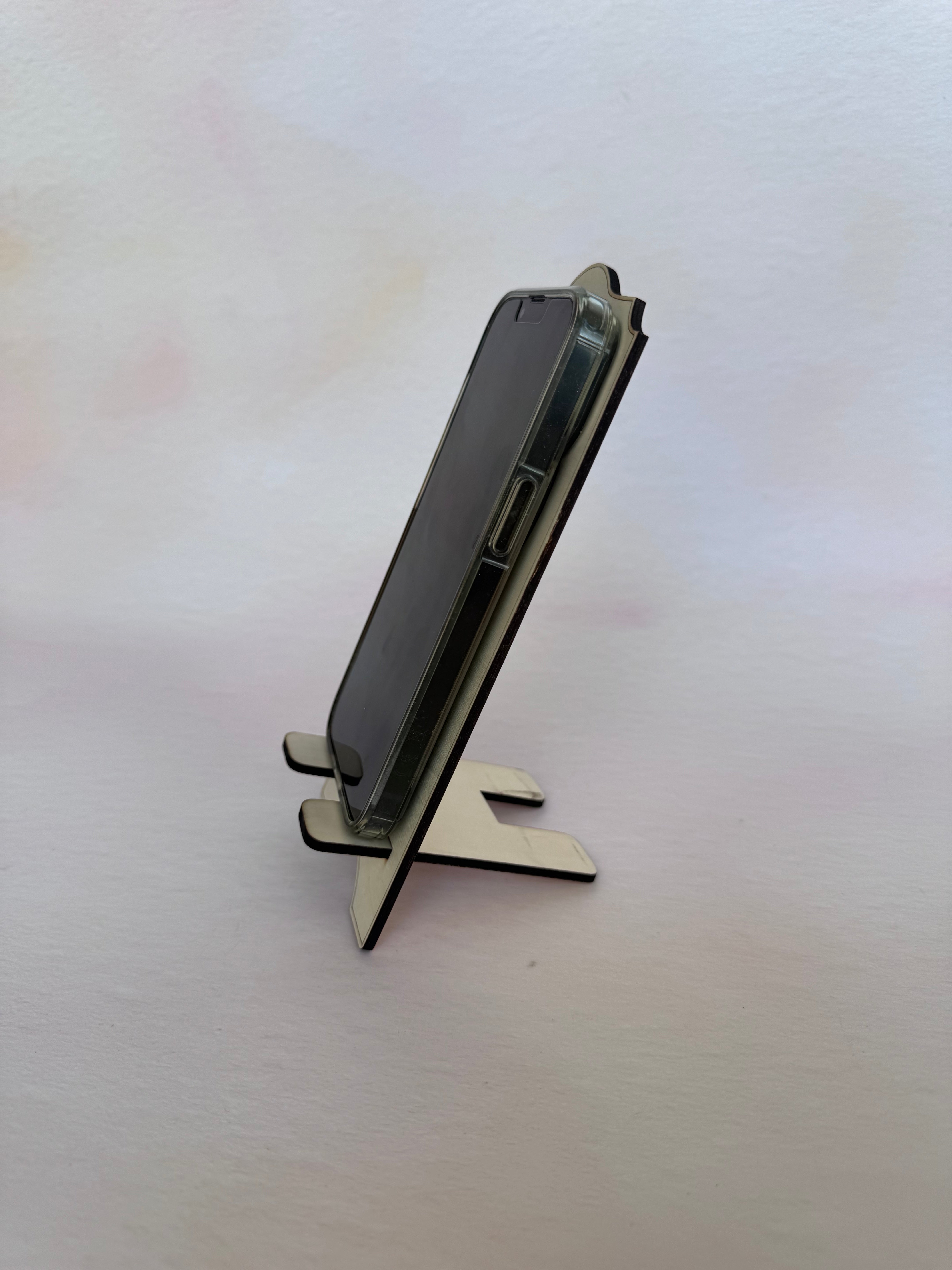 Engraved wooden phone stand with a phone, fourth view – Etch 'N' Shine