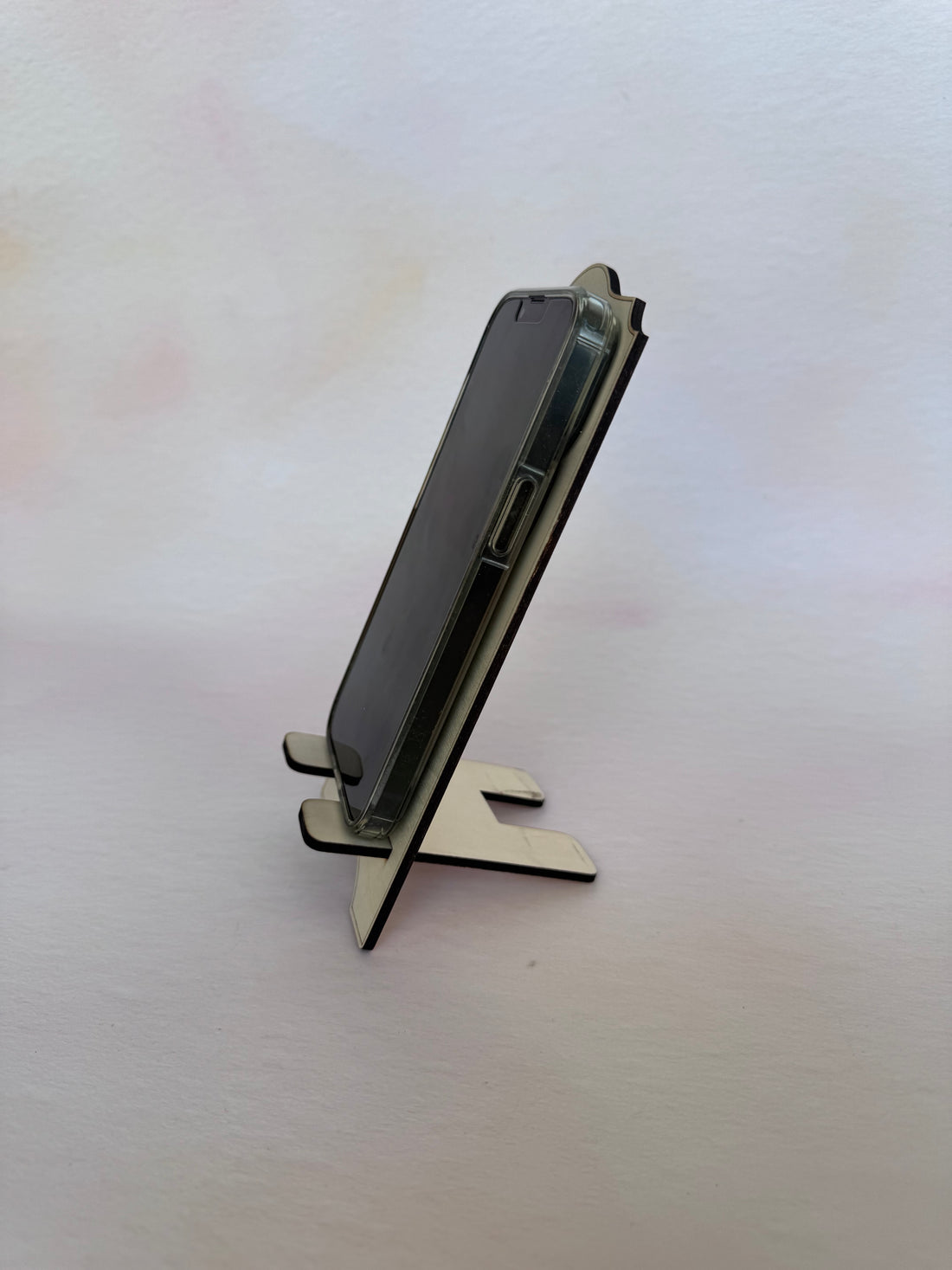 Engraved wooden phone stand with a phone, fourth view – Etch 'N' Shine