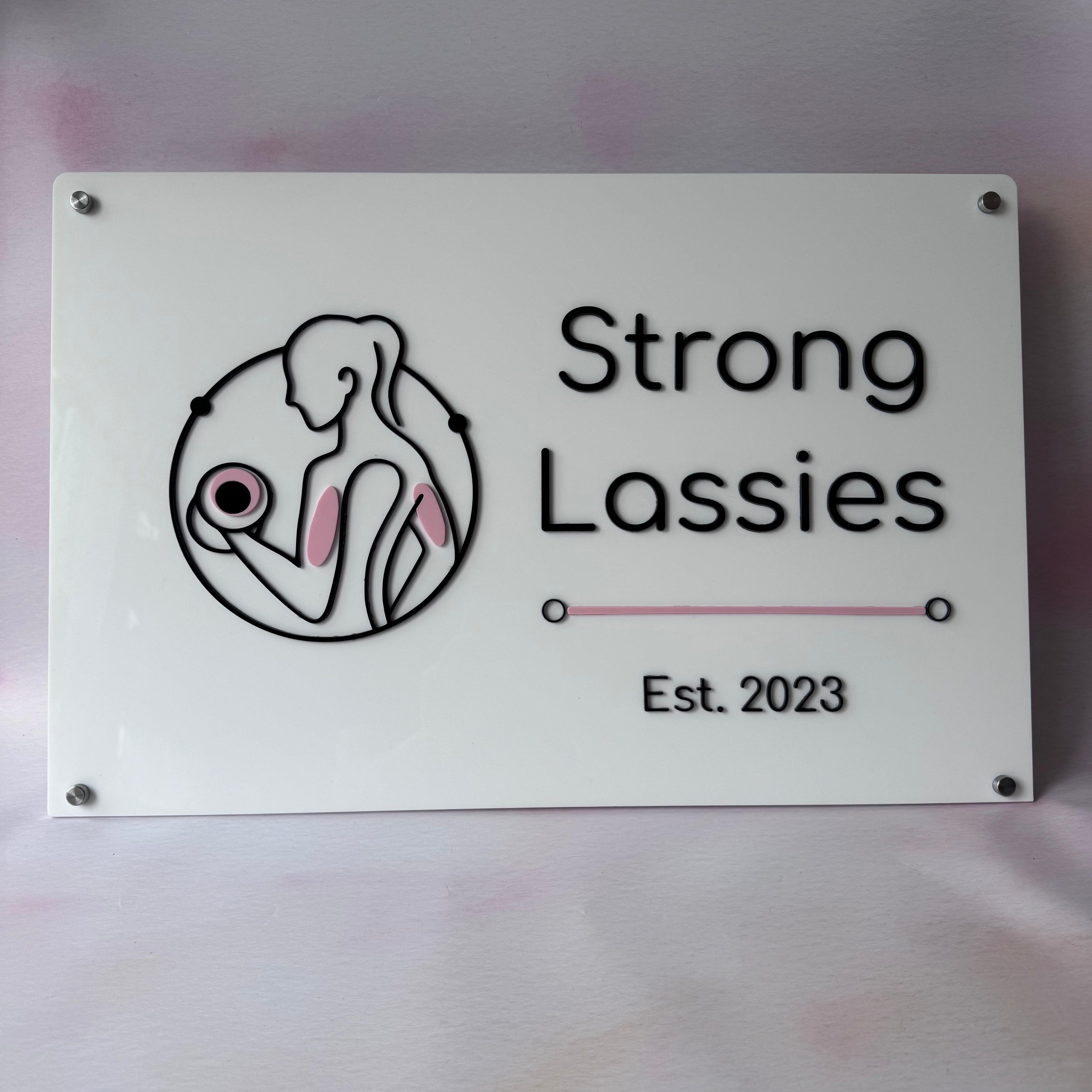 Custom rectangular acrylic logo wall sign for Strong Lassies