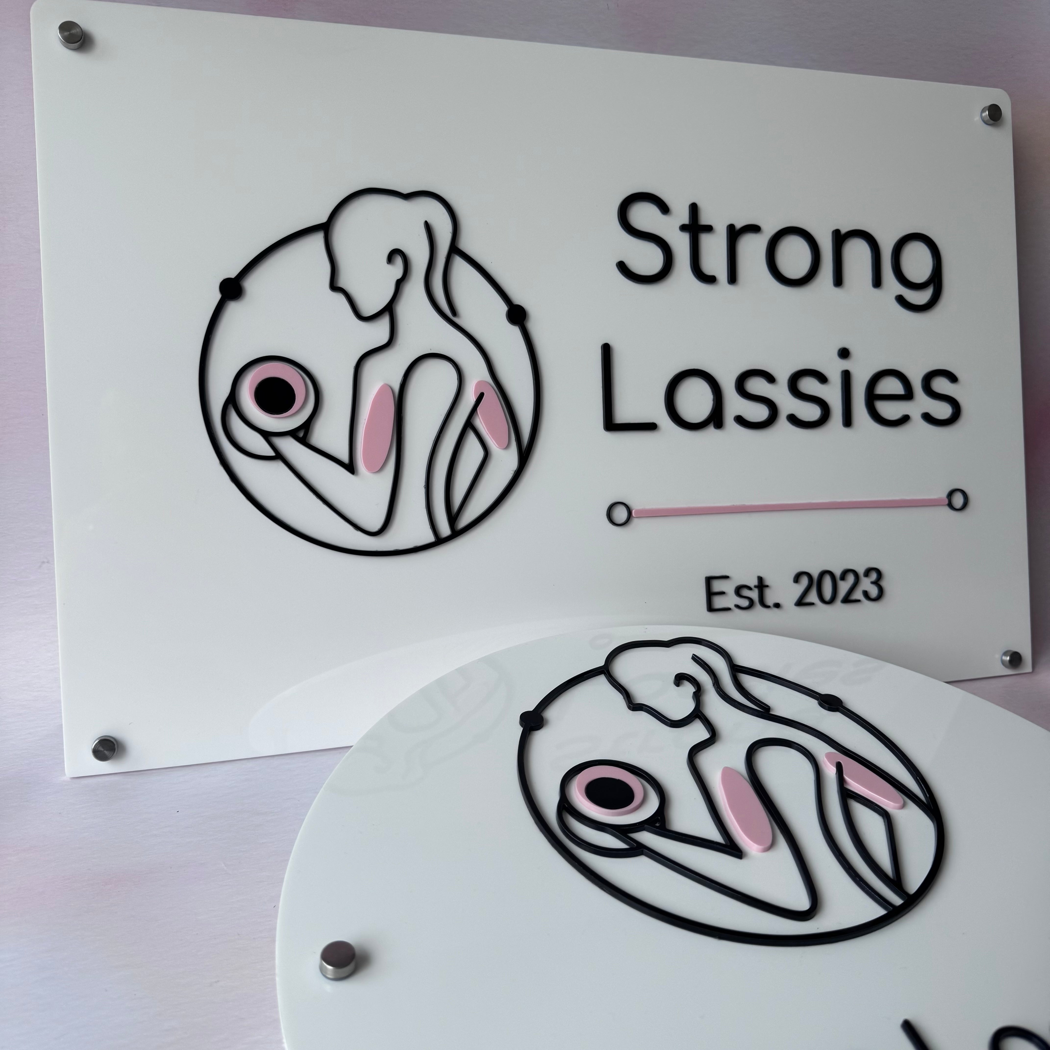 Custom layered acrylic business signs for Strong Lassies gym branding
