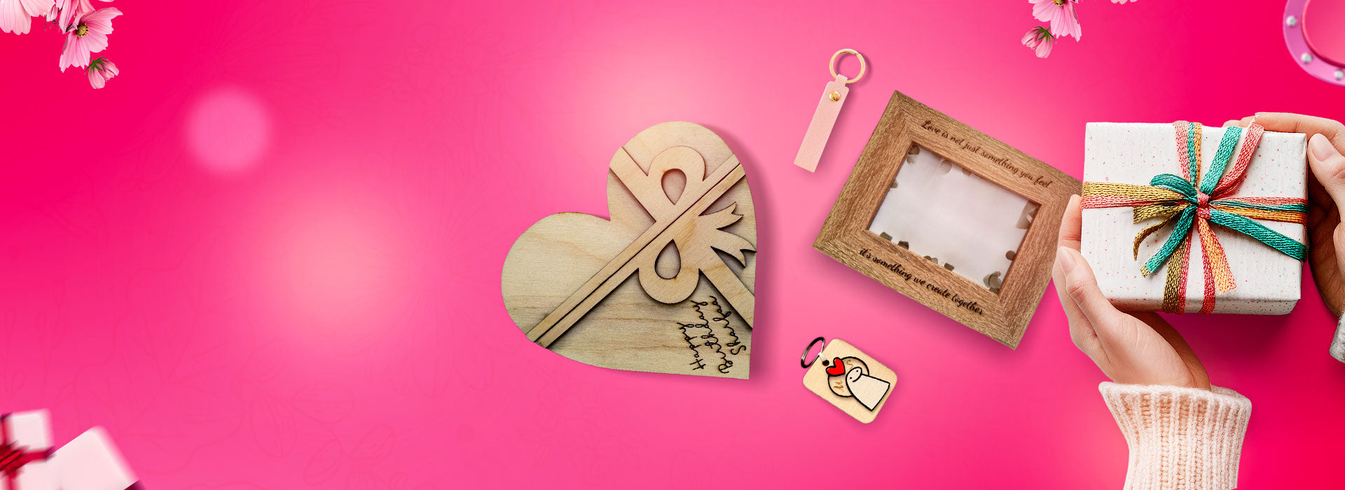 Heart-shaped wooden box, photo frame, keychain, and gift with ribbon on a pink background