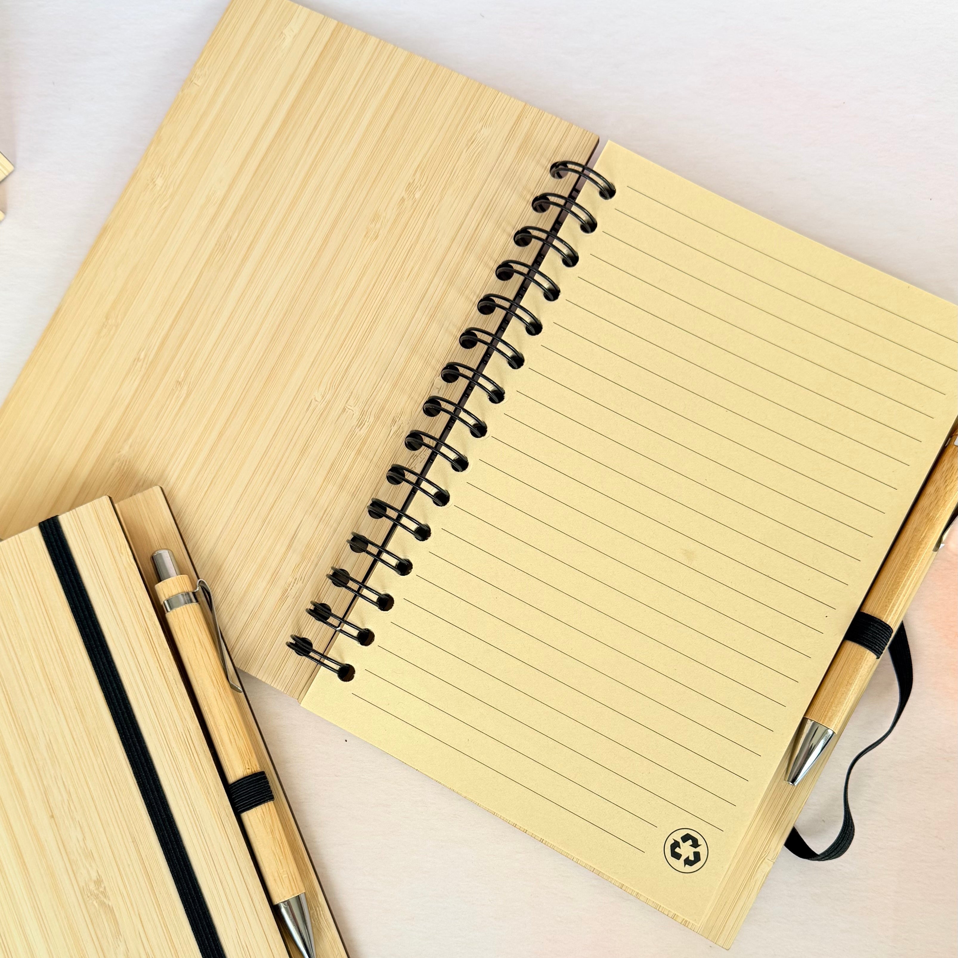 Notebook with pen and pencil on a light background