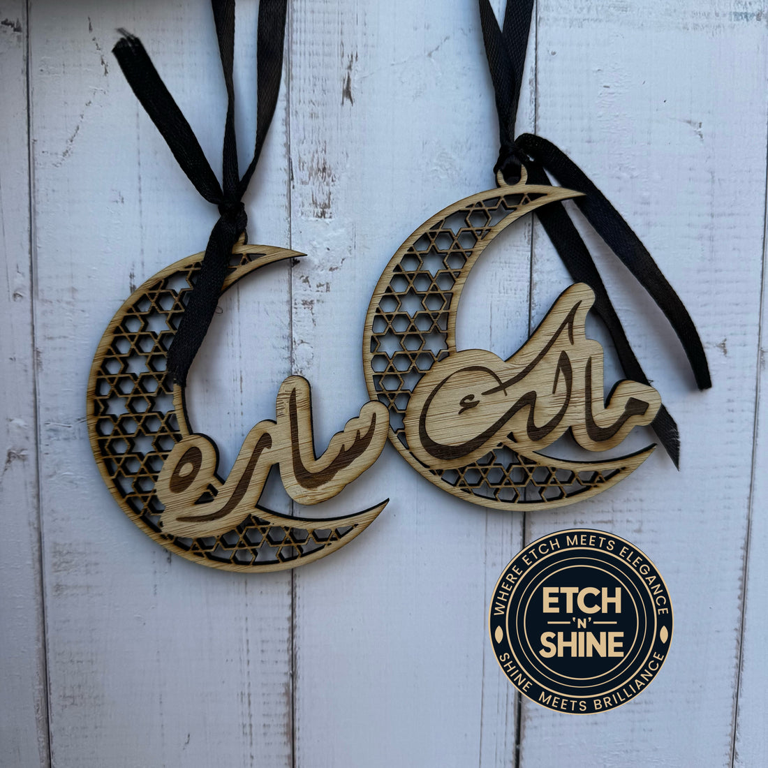 Wooden moon-shaped decorations with engraved text on a white wooden background, featuring the 'Etch n' Shine' brand.