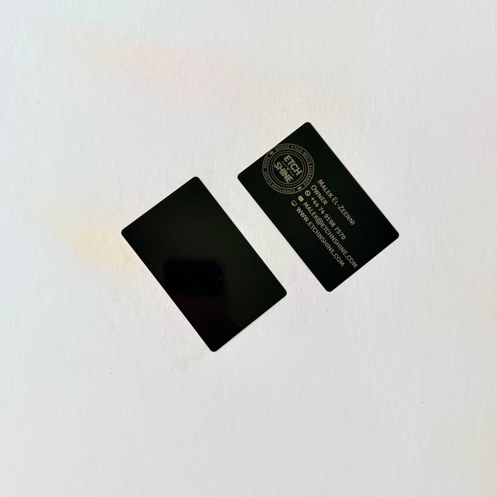 Two black business cards on a white background