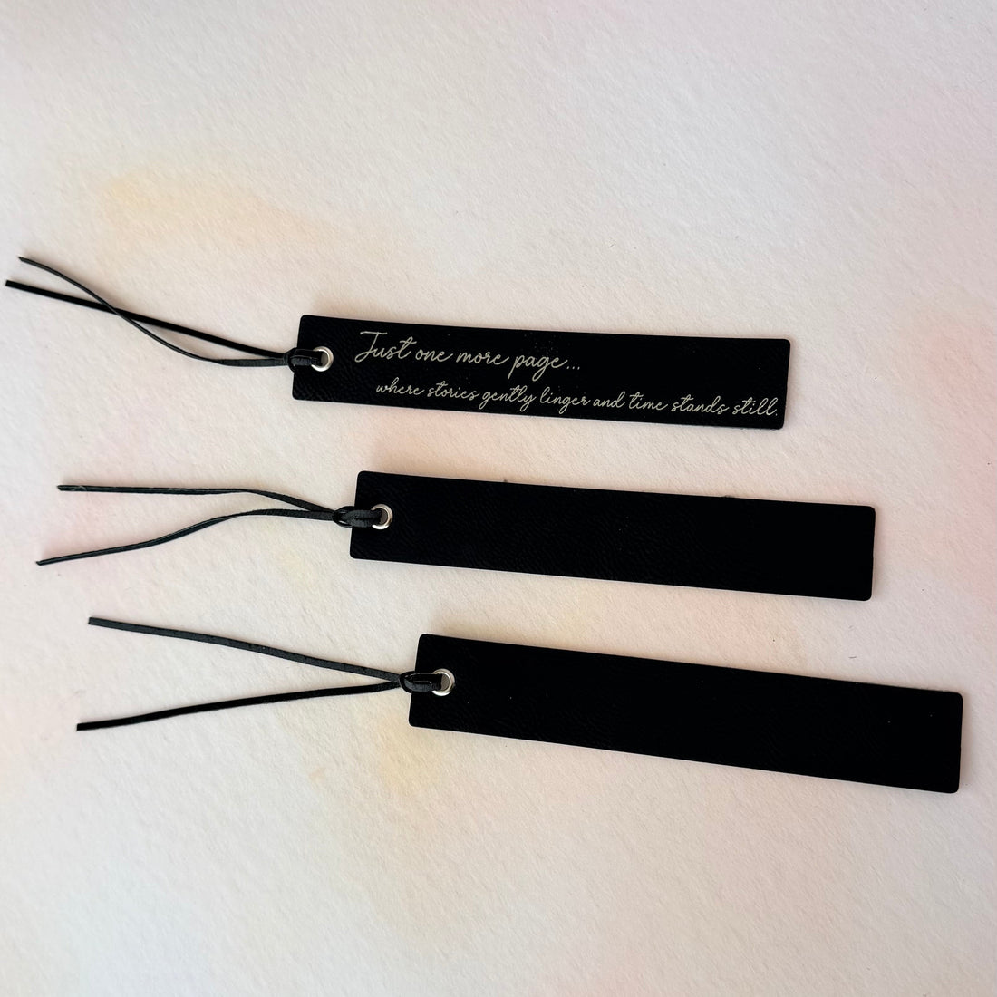 Black bookmarks with text on a light background