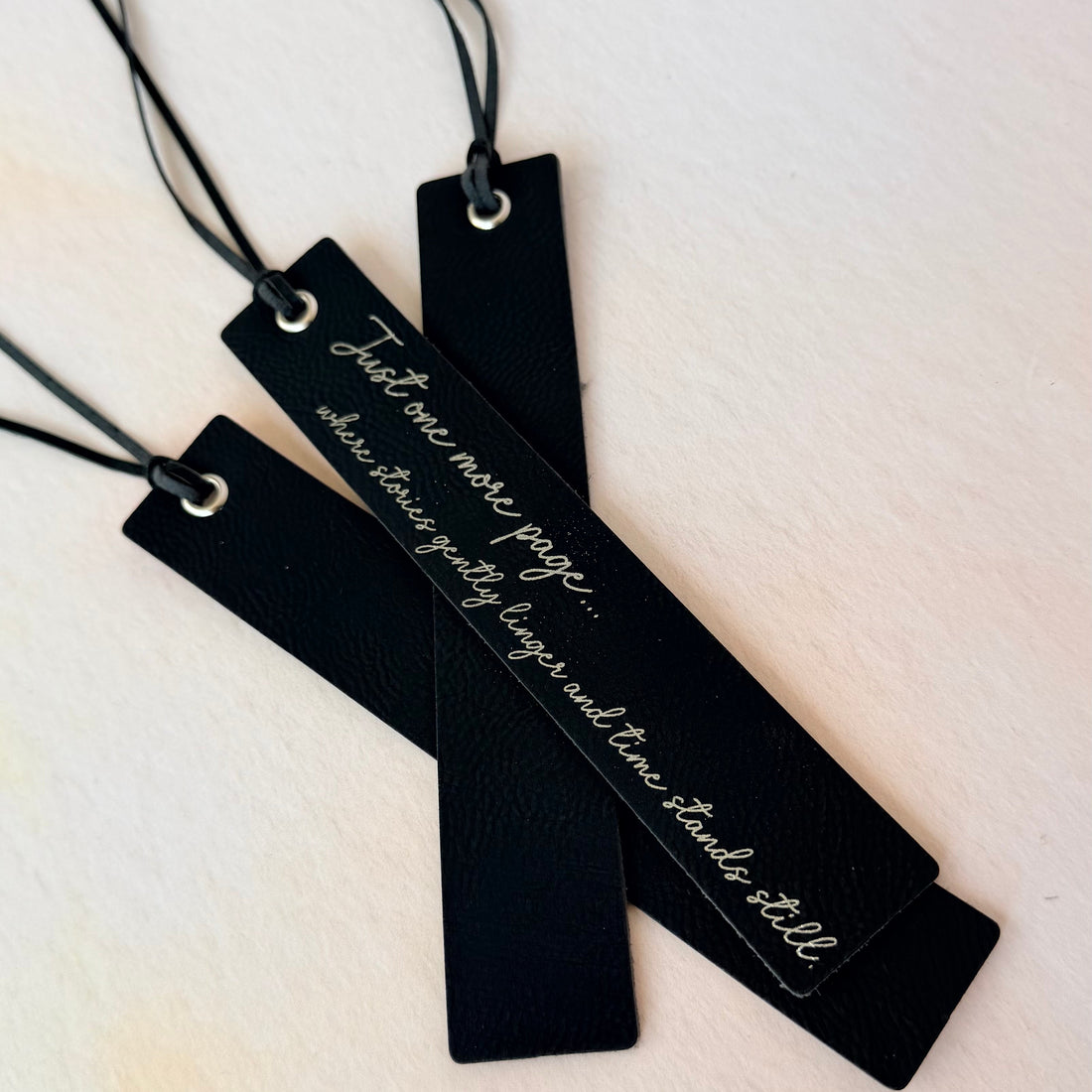 Black bookmarks with text on a light background