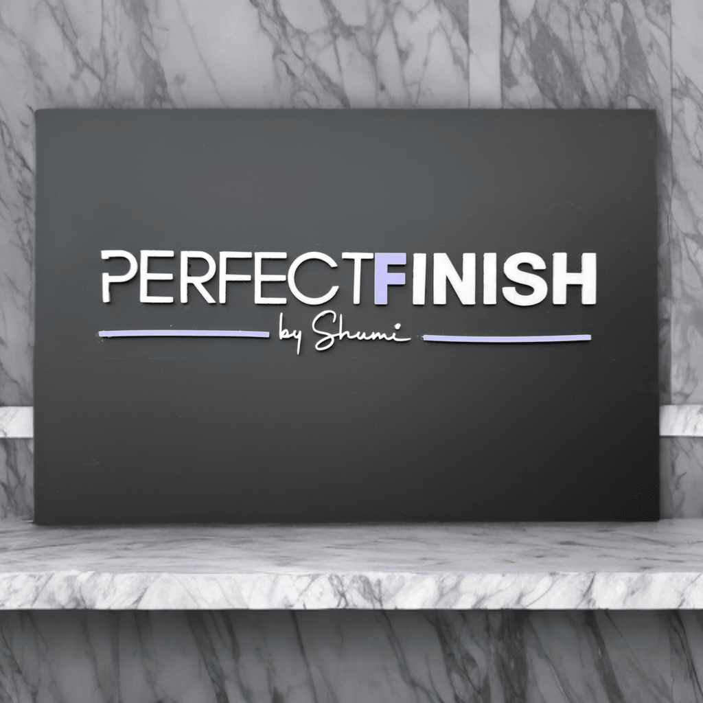 Dark acrylic business sign with custom brand name on a marble shelf – personalised acrylic sign – Etch 'N' Shine