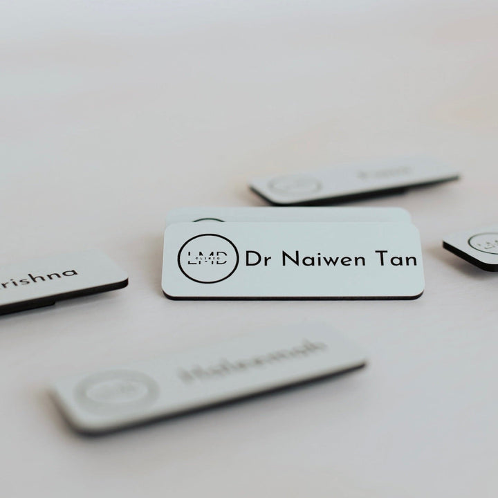 White acrylic badges with custom logo and name – personalised engraved name badges – Etch 'N' Shine