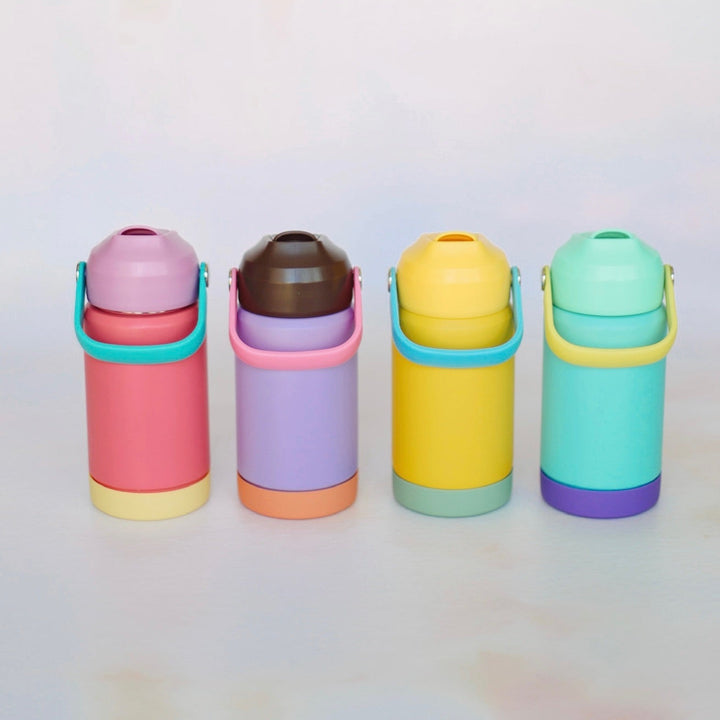 Four colorful thermos bottles on a light gray background