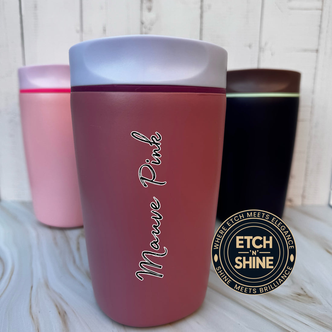 Pink tumbler with 'Mauve Pink' text and Etch 'N' Shine logo on a light wooden surface.