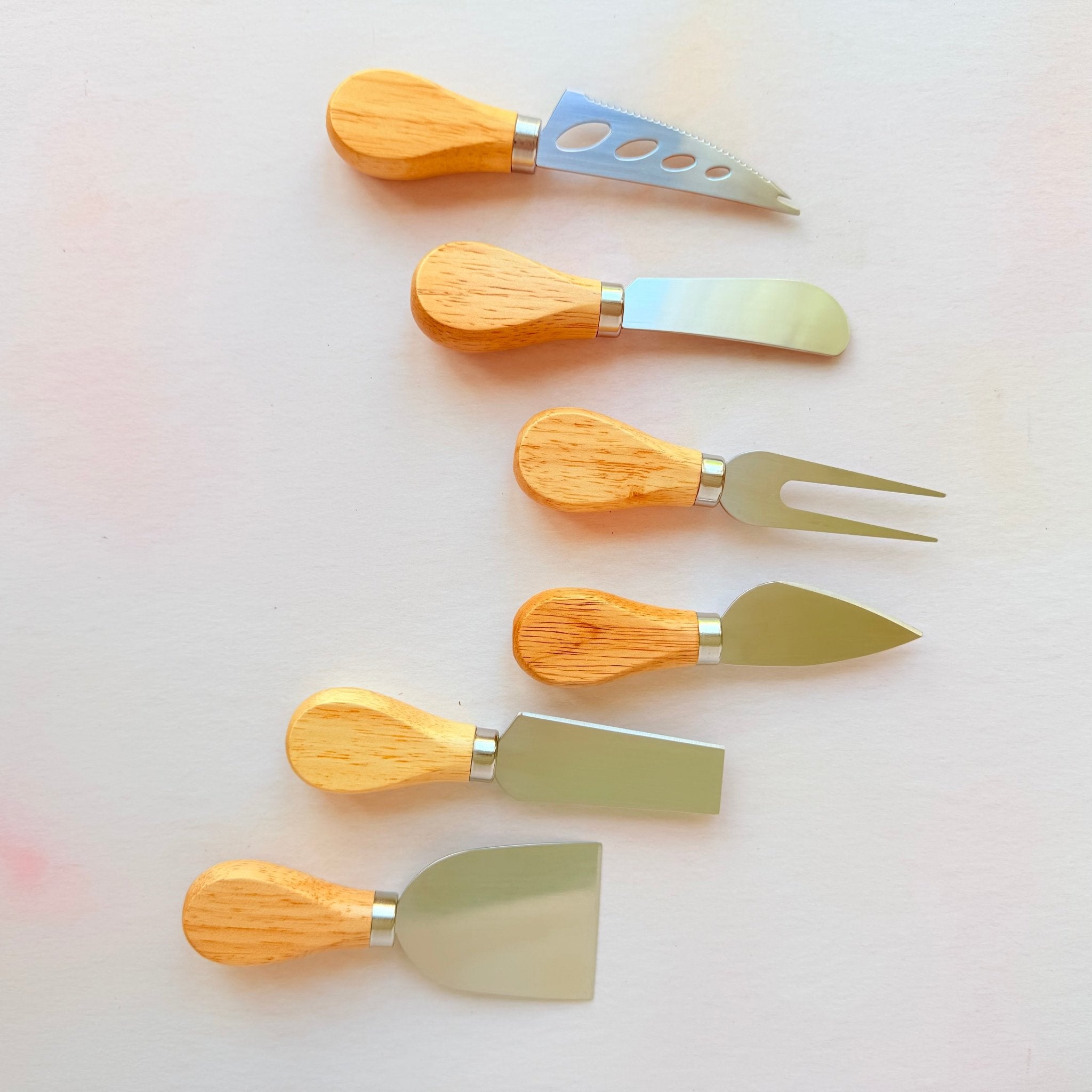 Six acacia-handled cheese knives laid out – personalised steel cheese knife set – Etch 'N' Shine