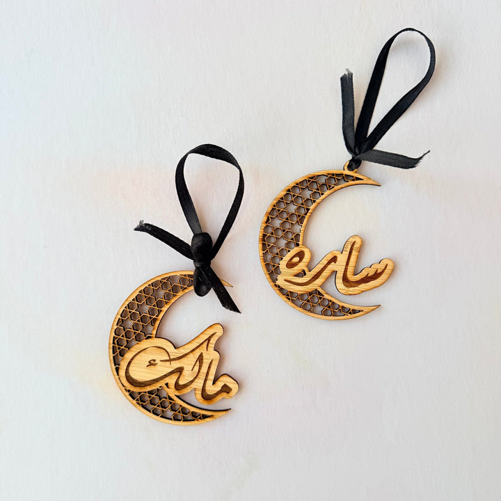Two wooden crescent ornaments with custom Arabic names – personalised hanging decorations – Etch 'N' Shine