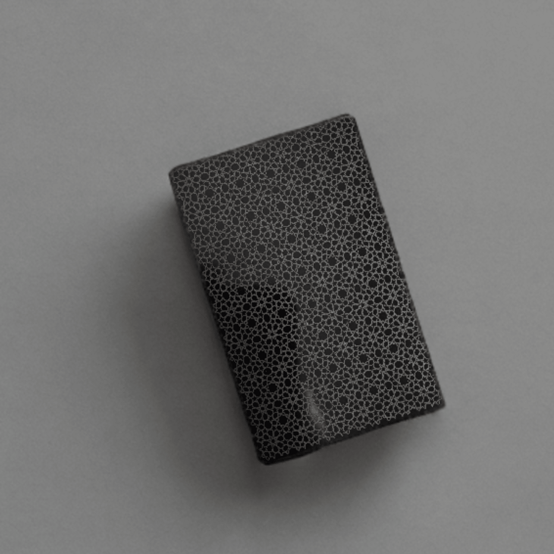 Black anodised aluminium business card with laser-engraved geometric pattern – custom metal business card – Etch 'N' Shine