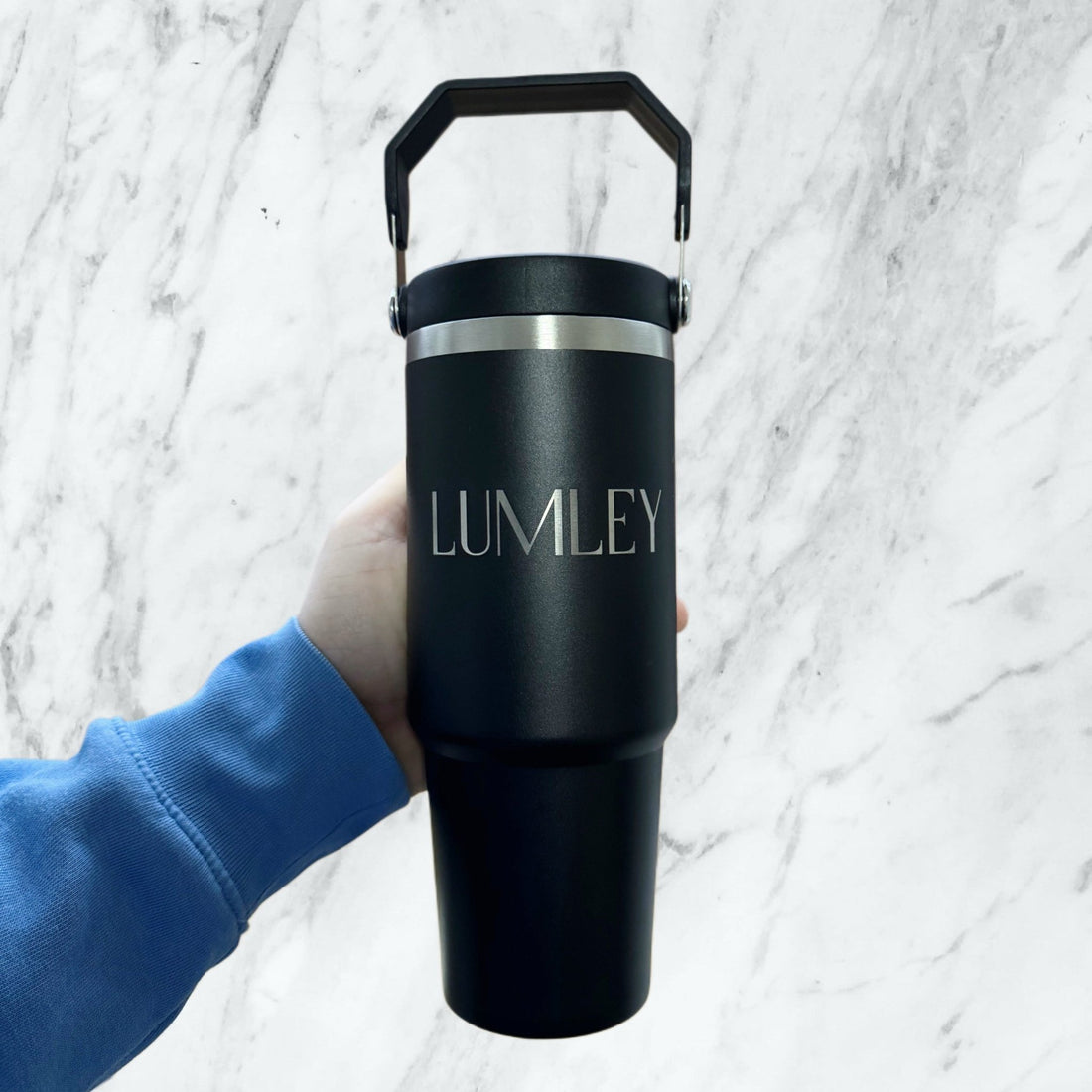 Black steel tumbler with custom name held in hand – personalised gym water bottle – Etch 'N' Shine