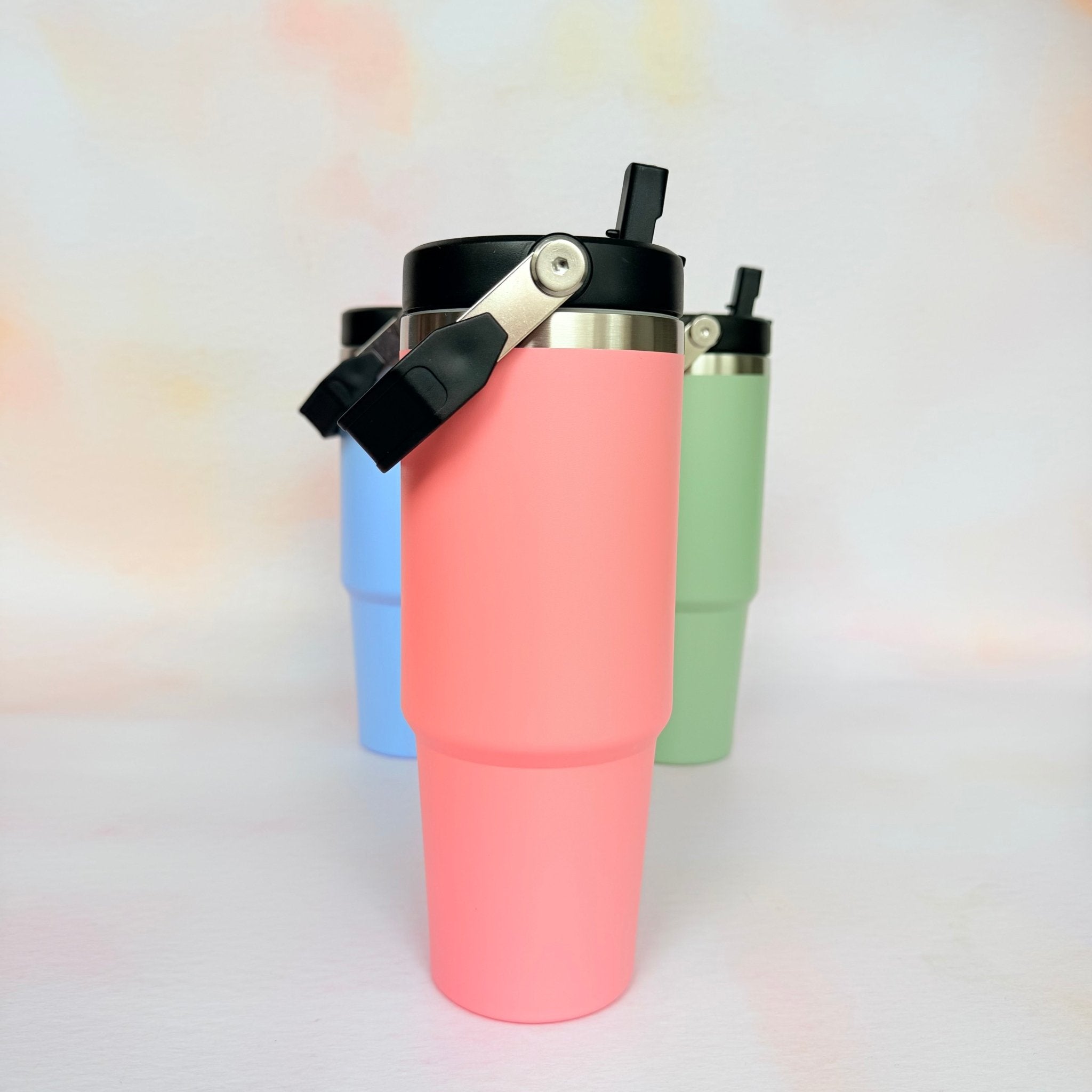 Three colour variants of insulated tumbler in pink, blue and green – personalised steel water bottle – Etch 'N' Shine