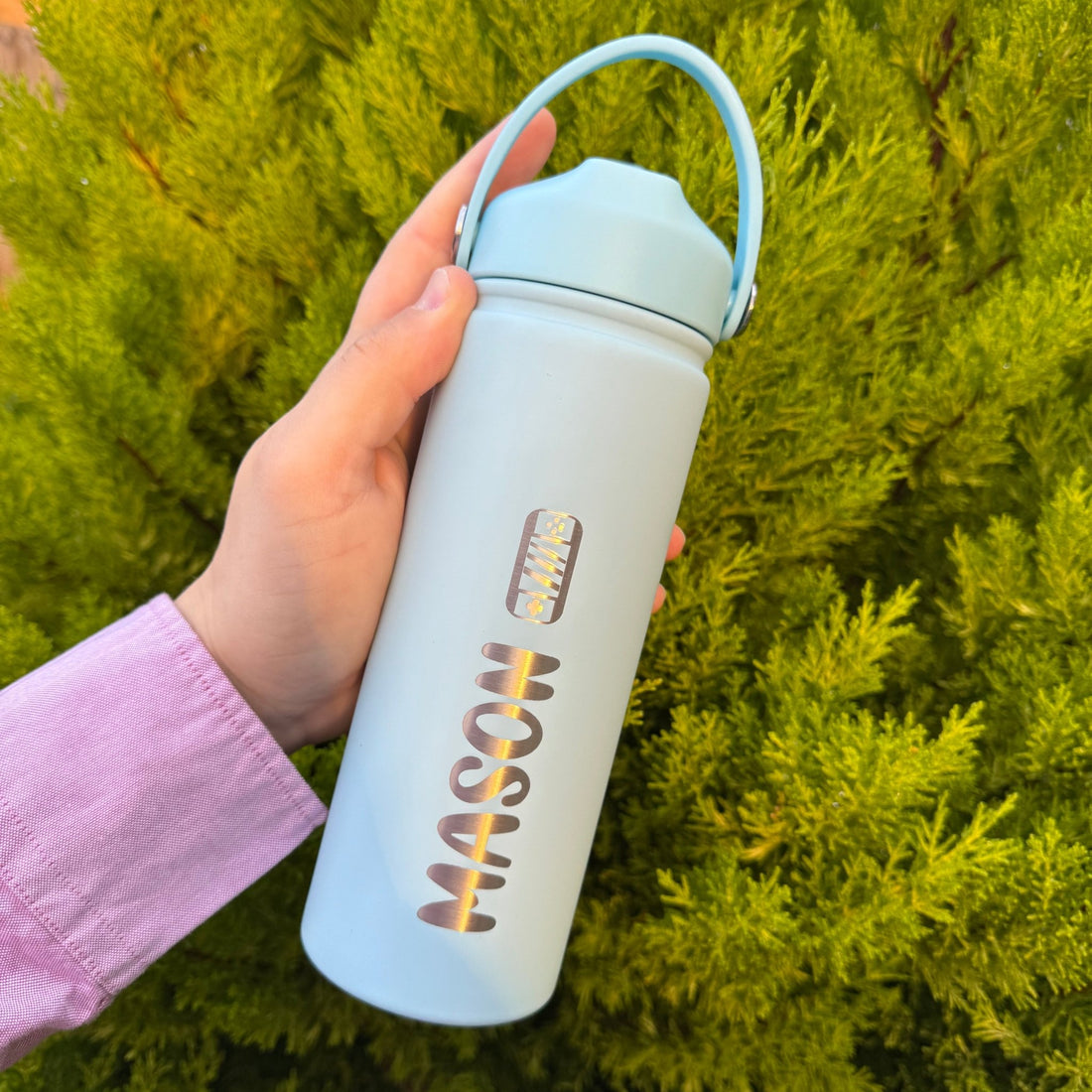 Mint insulated bottle with custom name held outdoors – personalised steel water bottle – Etch 'N' Shine