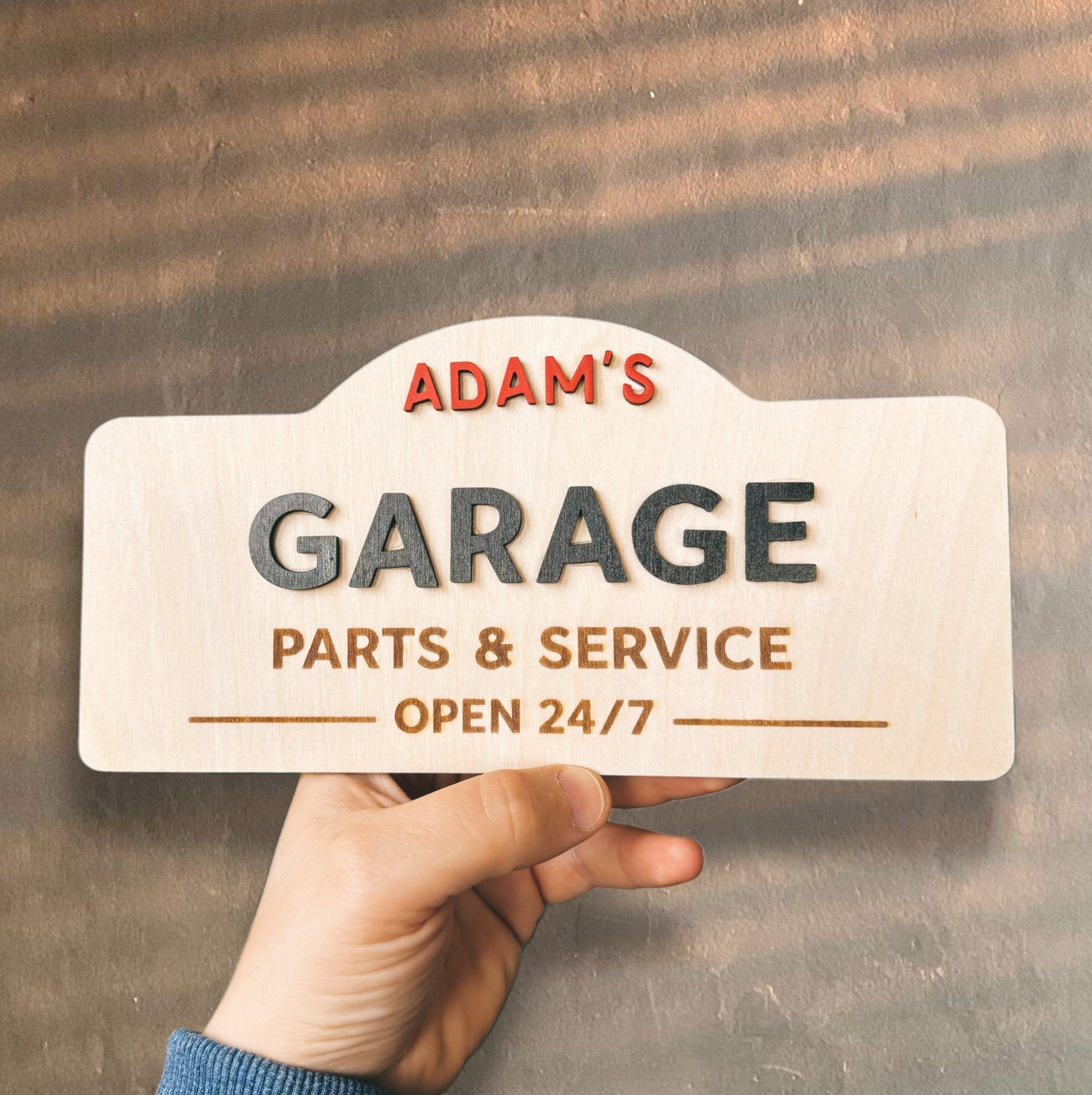 Hand holding wooden garage sign with custom name – personalised engraved wood plaque – Etch 'N' Shine