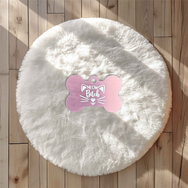 Pink bone-shaped tag with engraved cat design – personalised metal pet tag – Etch 'N' Shine