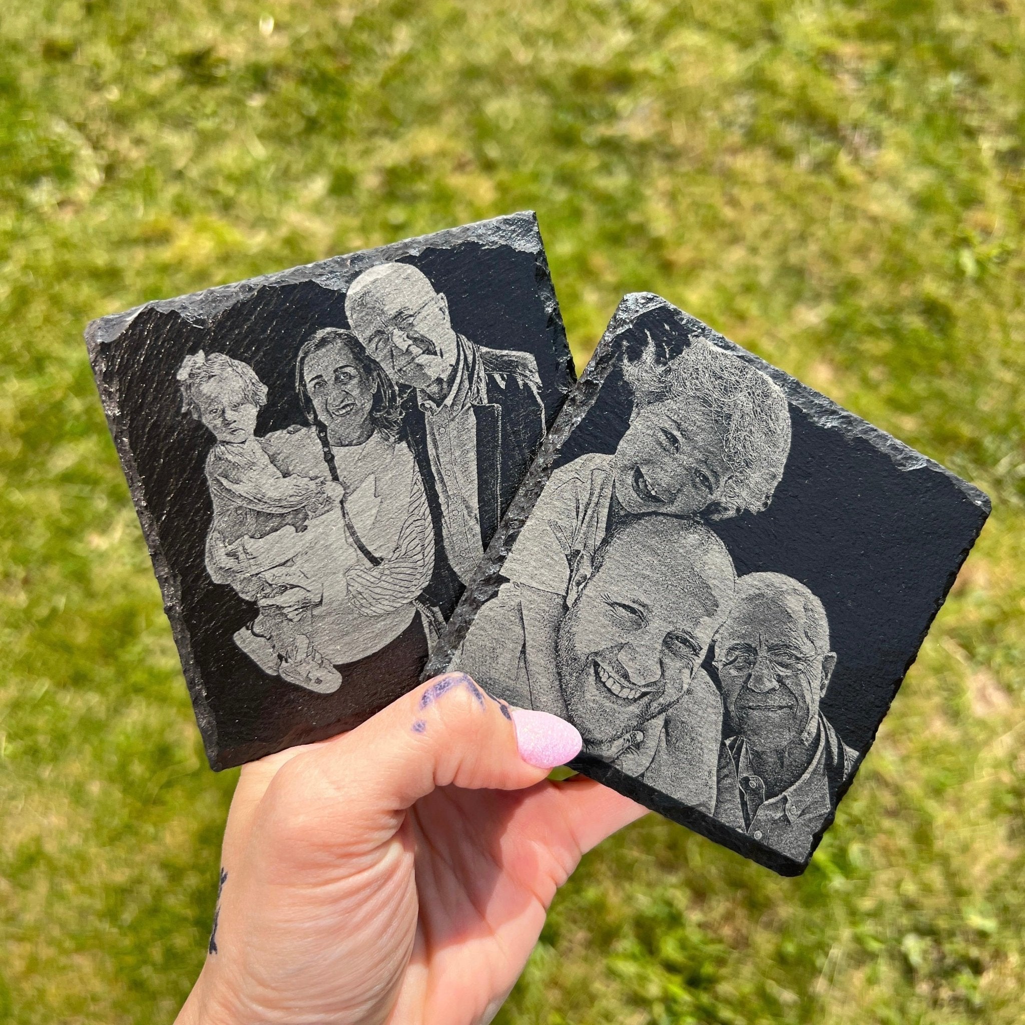 Two slate coasters with engraved custom photos held outdoors – personalised slate coasters – Etch 'N' Shine