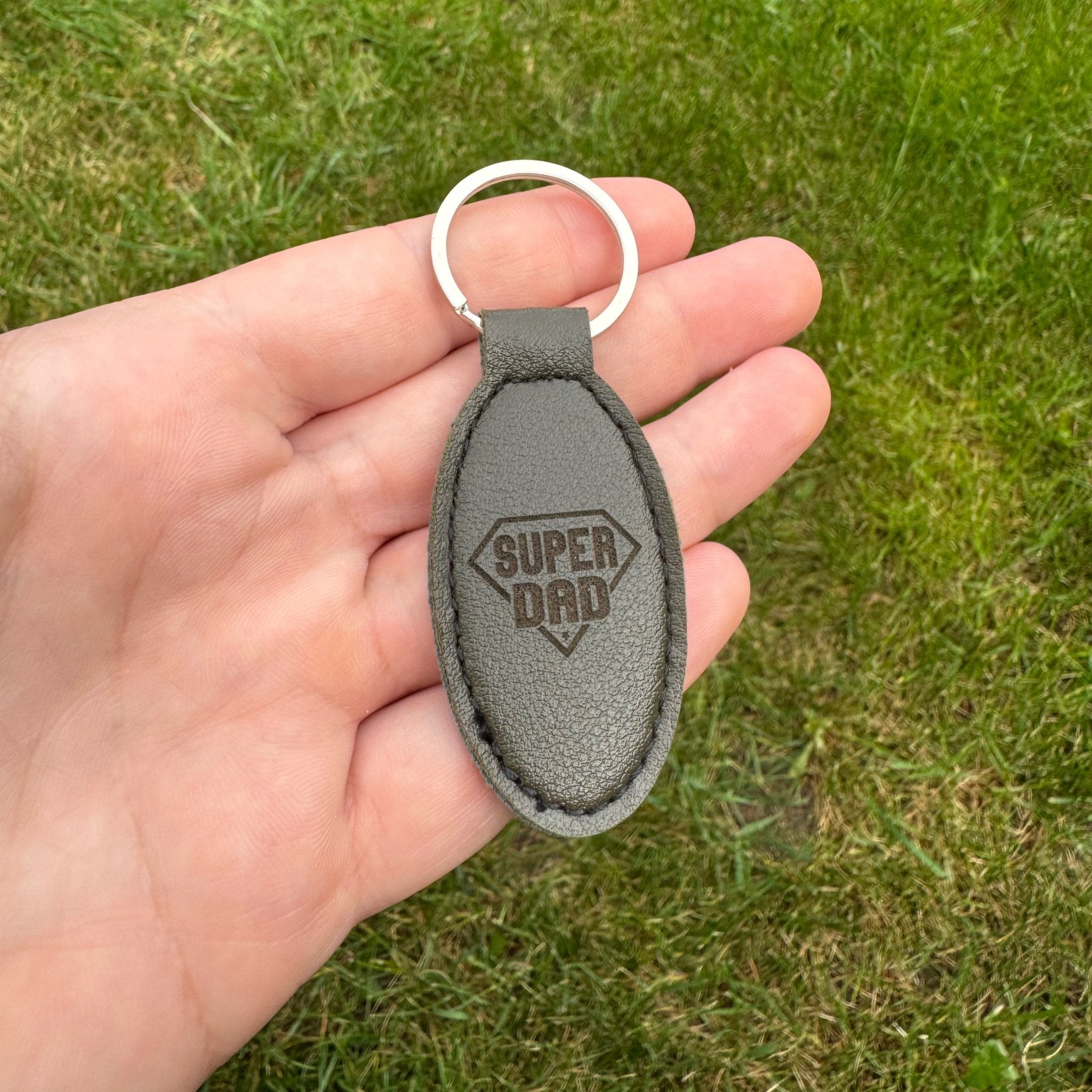 Oval engraved leather keyring with custom text and shield motif – personalised PU leather keyring – Etch 'N' Shine