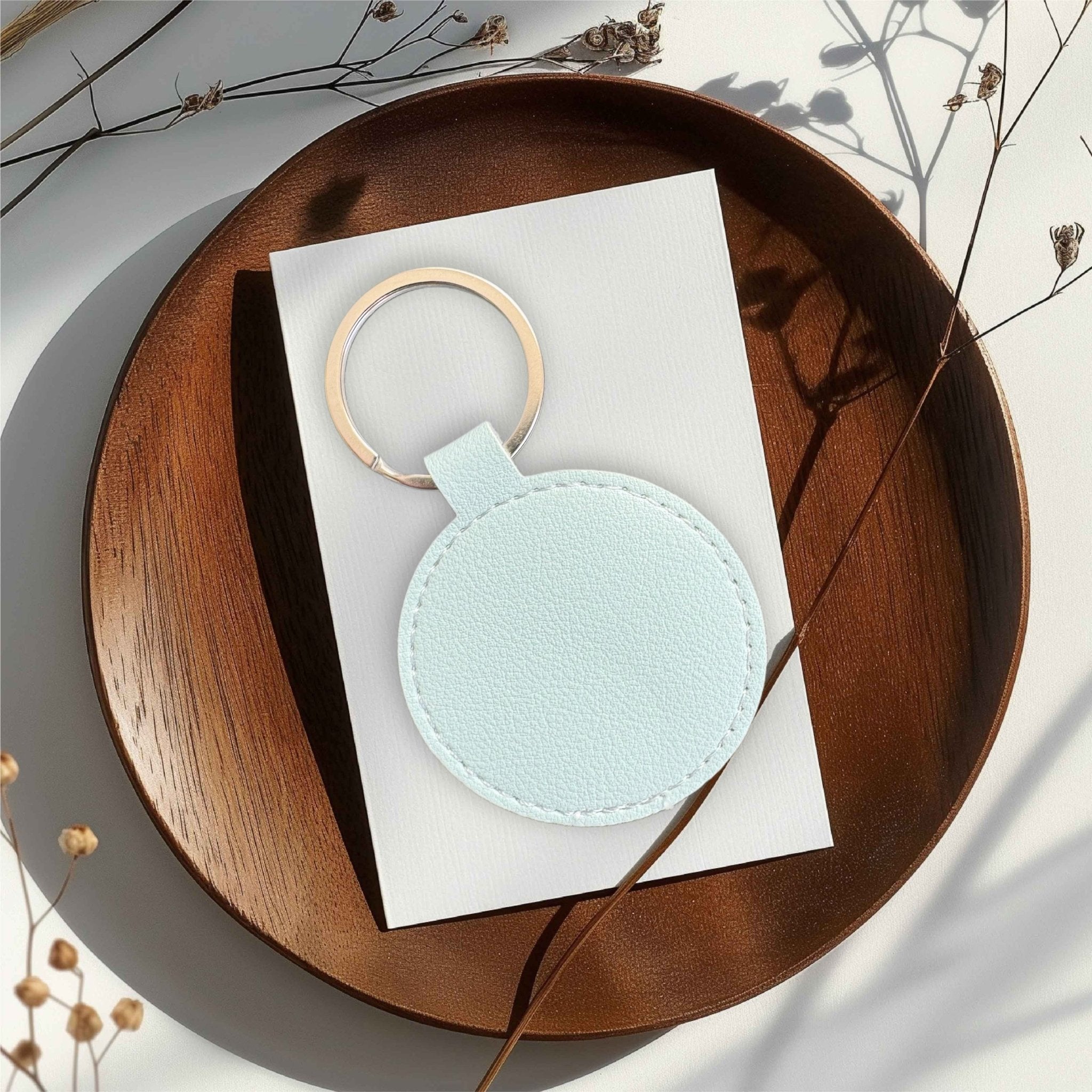 Pale blue round keyring on white card – personalised engraved leather keyring – Etch 'N' Shine