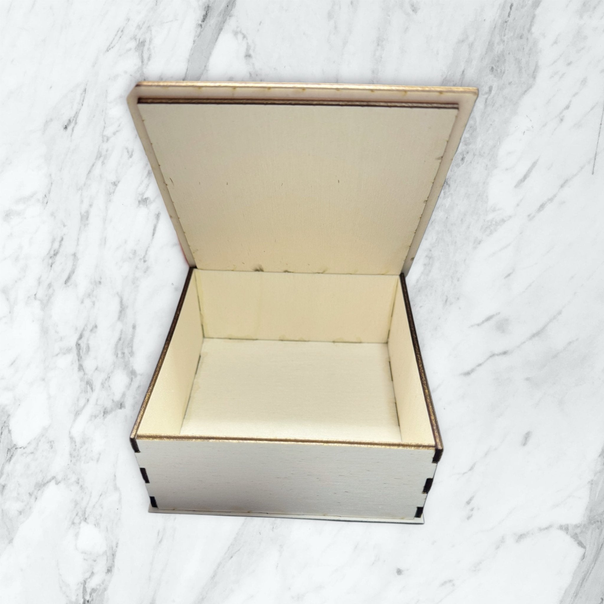 Open hinged wooden keepsake box on marble surface showing interior – personalised wooden gift box – Etch 'N' Shine