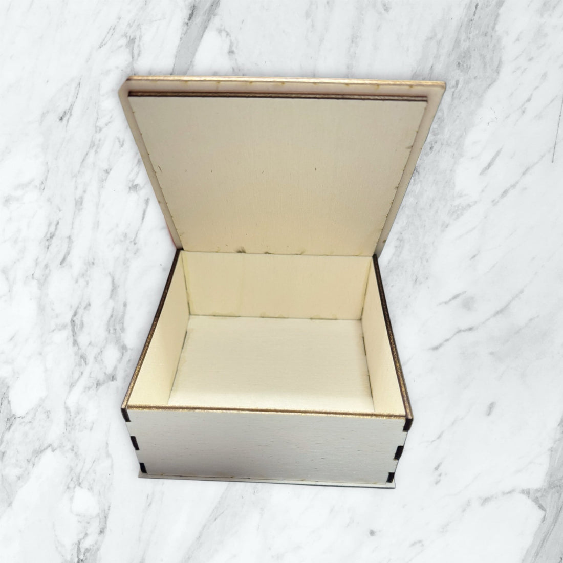 Open hinged wooden keepsake box on marble surface showing interior – personalised wooden gift box – Etch 'N' Shine