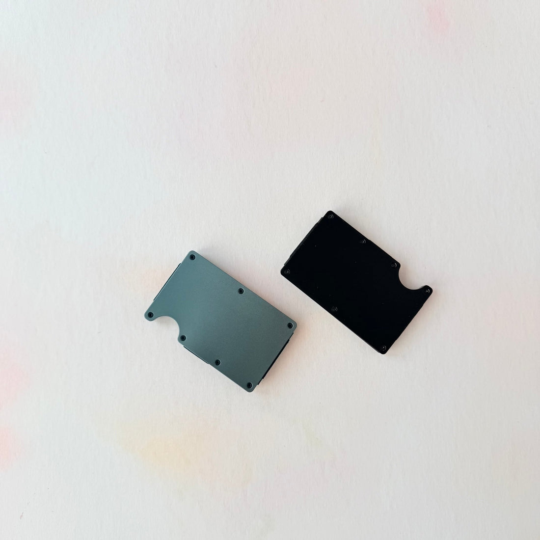 Grey and black colour variants of aluminium card wallet flat lay – personalised metal RFID wallet – Etch 'N' Shine