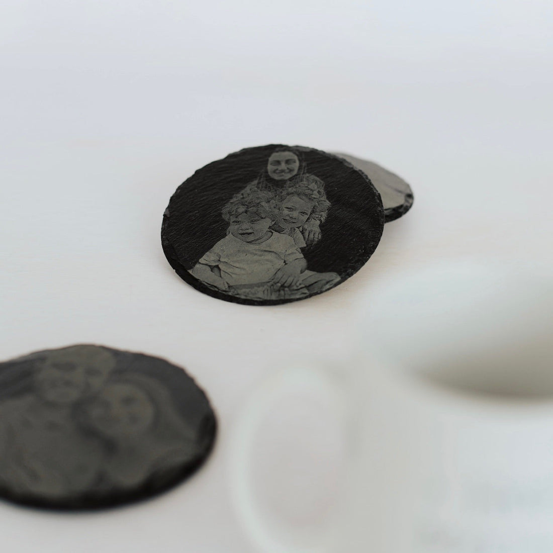 Round slate coaster laser-engraved with custom photo portrait – personalised slate coaster set – Etch 'N' Shine
