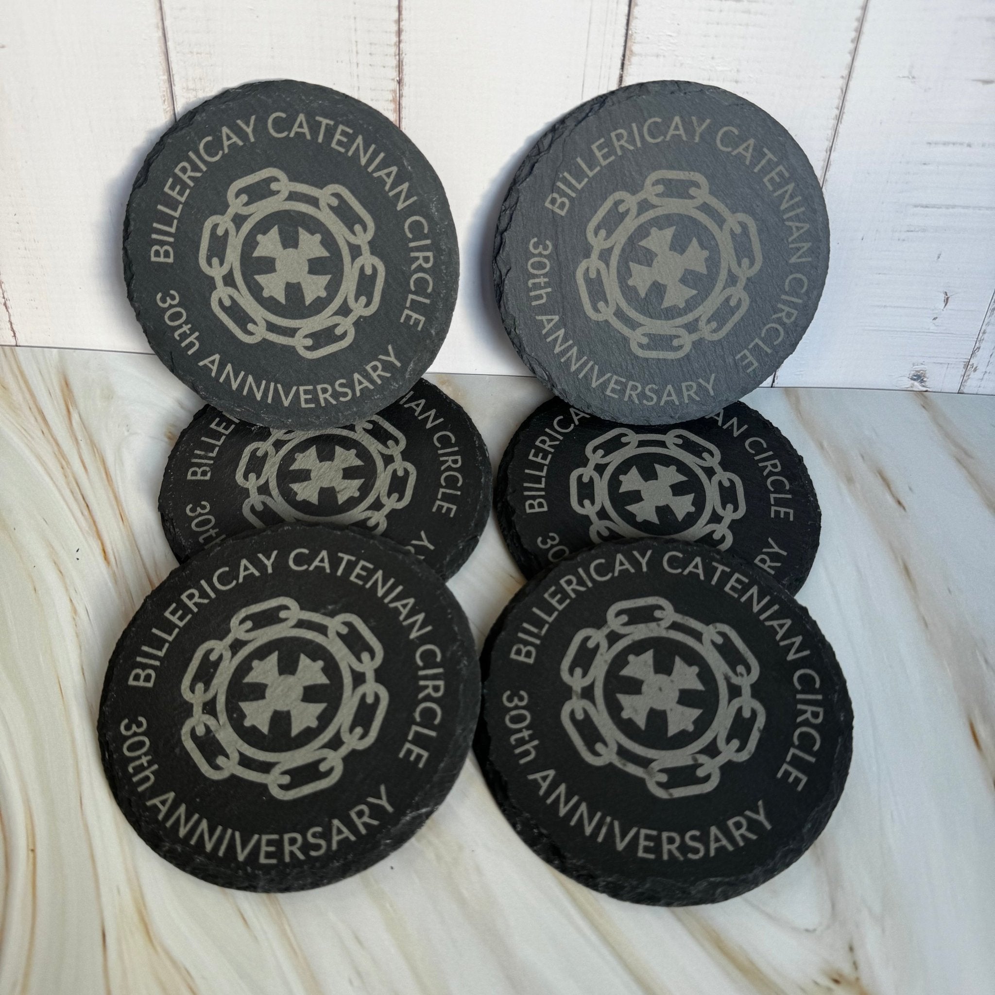 Six round slate coasters engraved with custom logo and personalised text – laser-engraved slate coaster set – Etch 'N' Shine