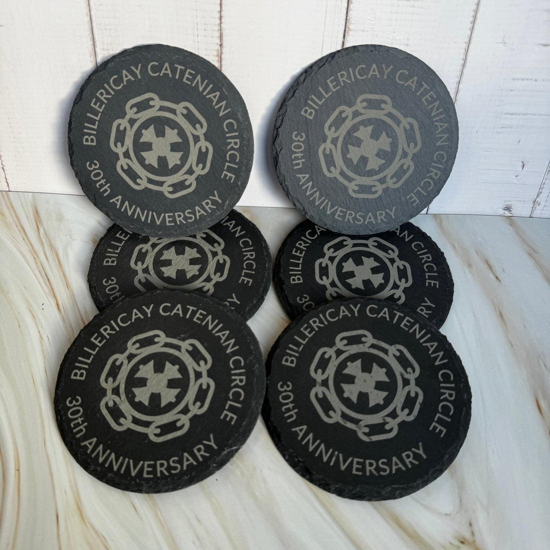 Six round slate coasters engraved with custom logo and personalised text – laser-engraved slate coaster set – Etch 'N' Shine