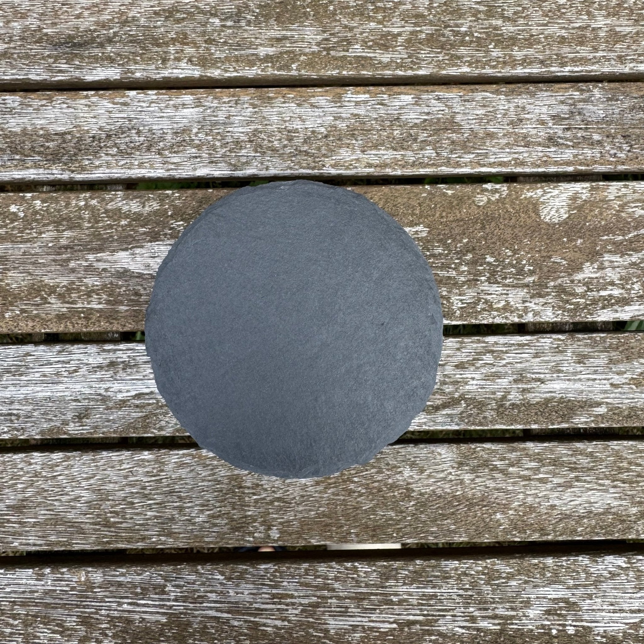 Plain round slate coaster on weathered wooden decking – slate coaster – Etch 'N' Shine