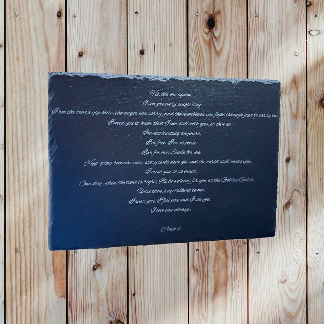 Laser-engraved slate plaque with personalised message against a wooden backdrop – engraved slate plaque – Etch 'N' Shine