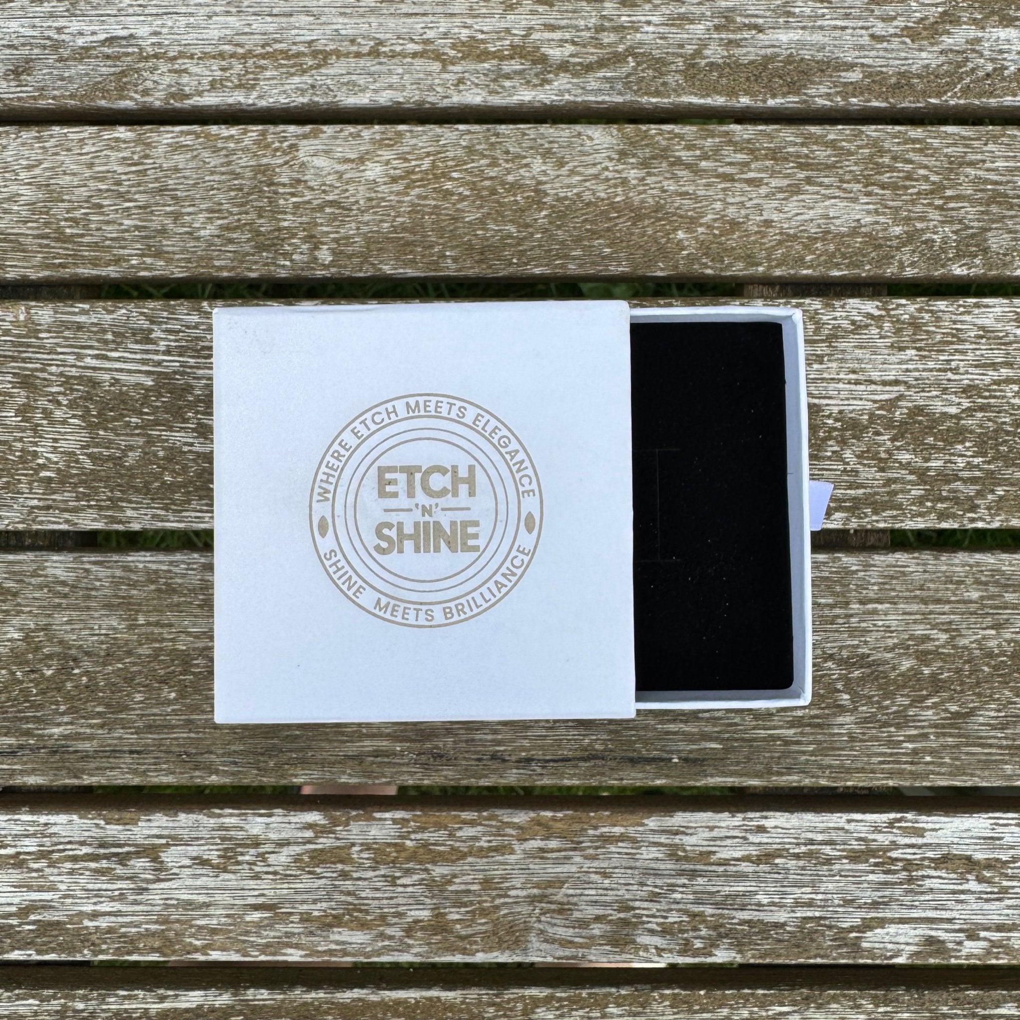 White branded gift box with black velvet insert, open on wooden surface – jewellery gift box – Etch 'N' Shine