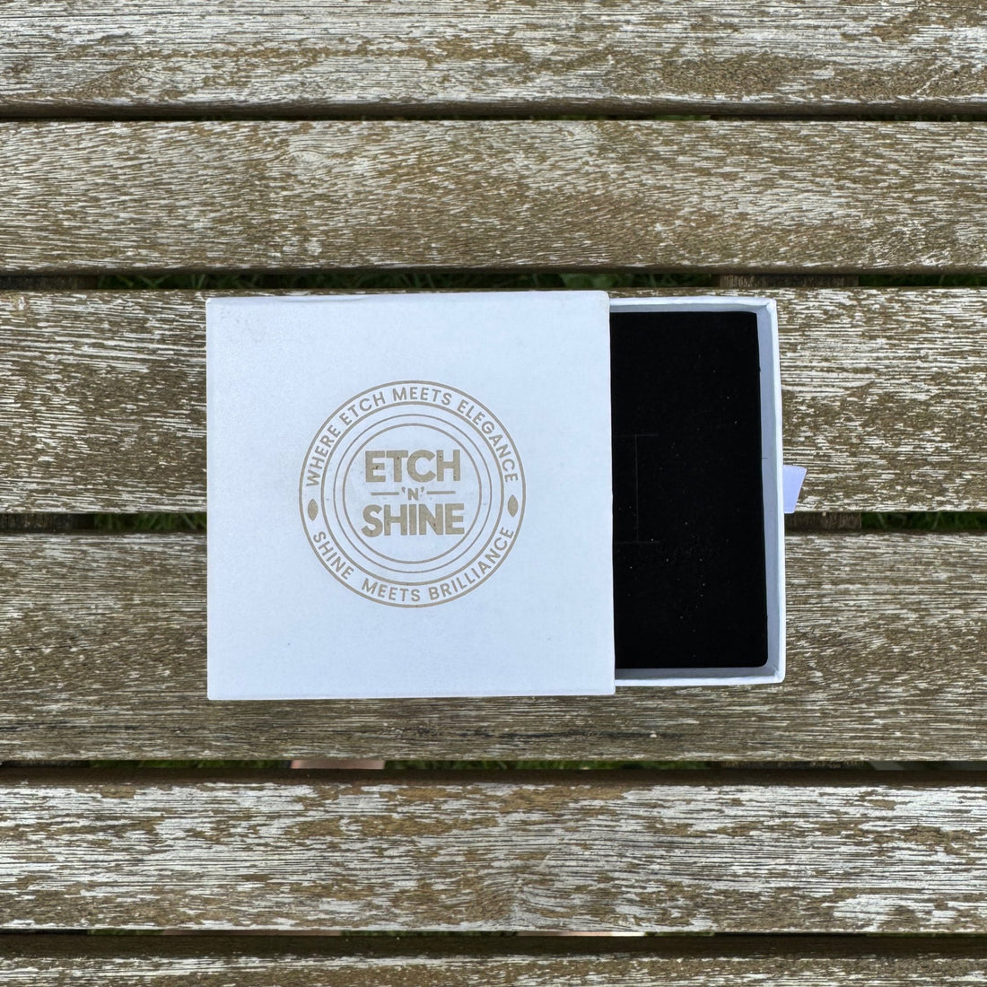 White branded gift box with black velvet insert, open on wooden surface – jewellery gift box – Etch 'N' Shine