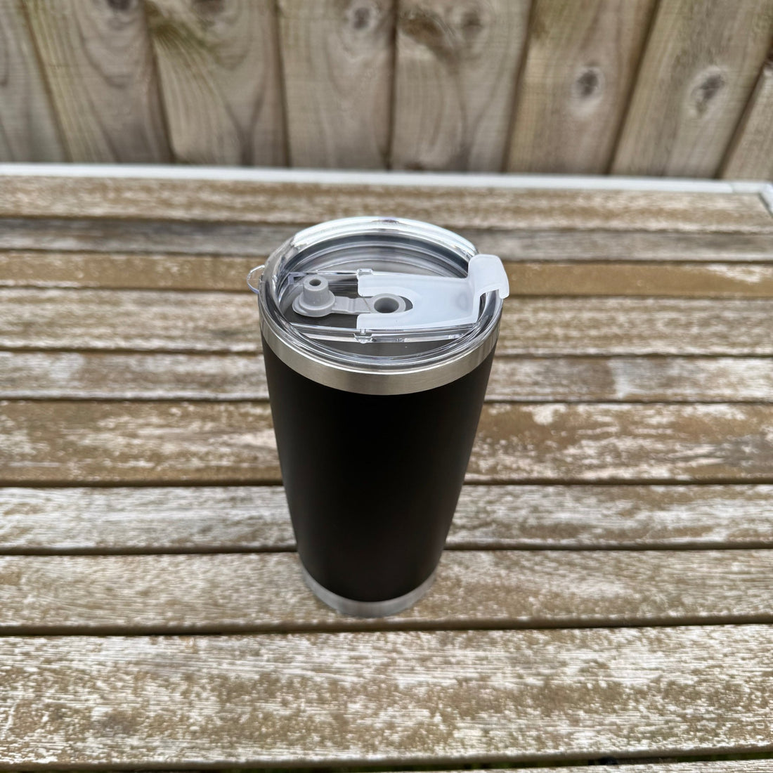 Black insulated tumbler with clear sliding lid on a wooden surface – personalised stainless steel tumbler – Etch 'N' Shine