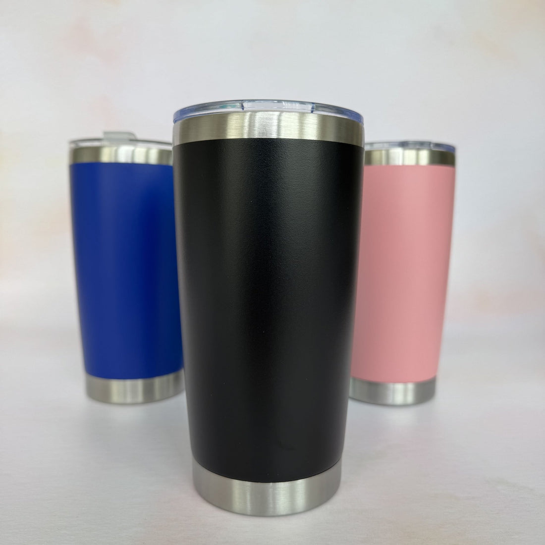 Three colour variants of insulated tumbler in black, blue, and pink – personalised stainless steel tumbler – Etch 'N' Shine