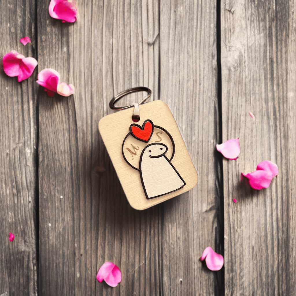 Engraved wooden keyring with heart and character design on a wooden surface – personalised wooden keyring – Etch 'N' Shine