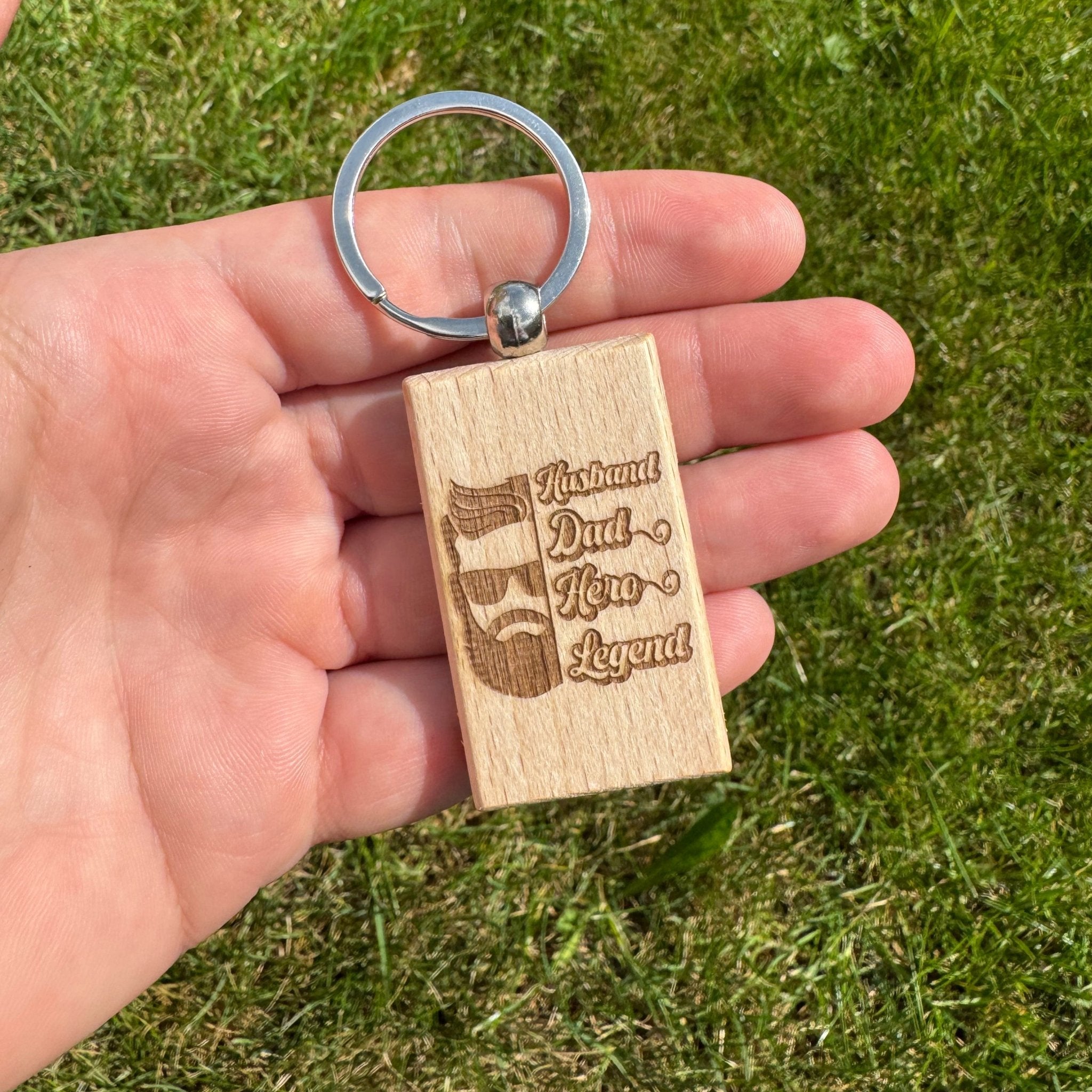 Engraved wooden keyring with dad design held in hand – personalised wooden keyring – Etch 'N' Shine